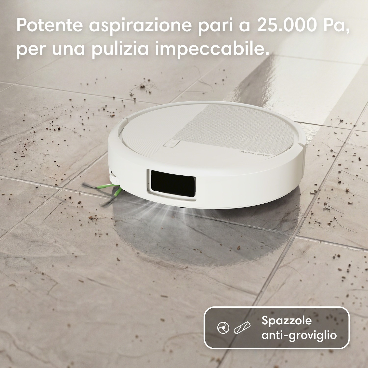 Un robot aspirapolvere bianco pulisce un pavimento piastrellato sporco.