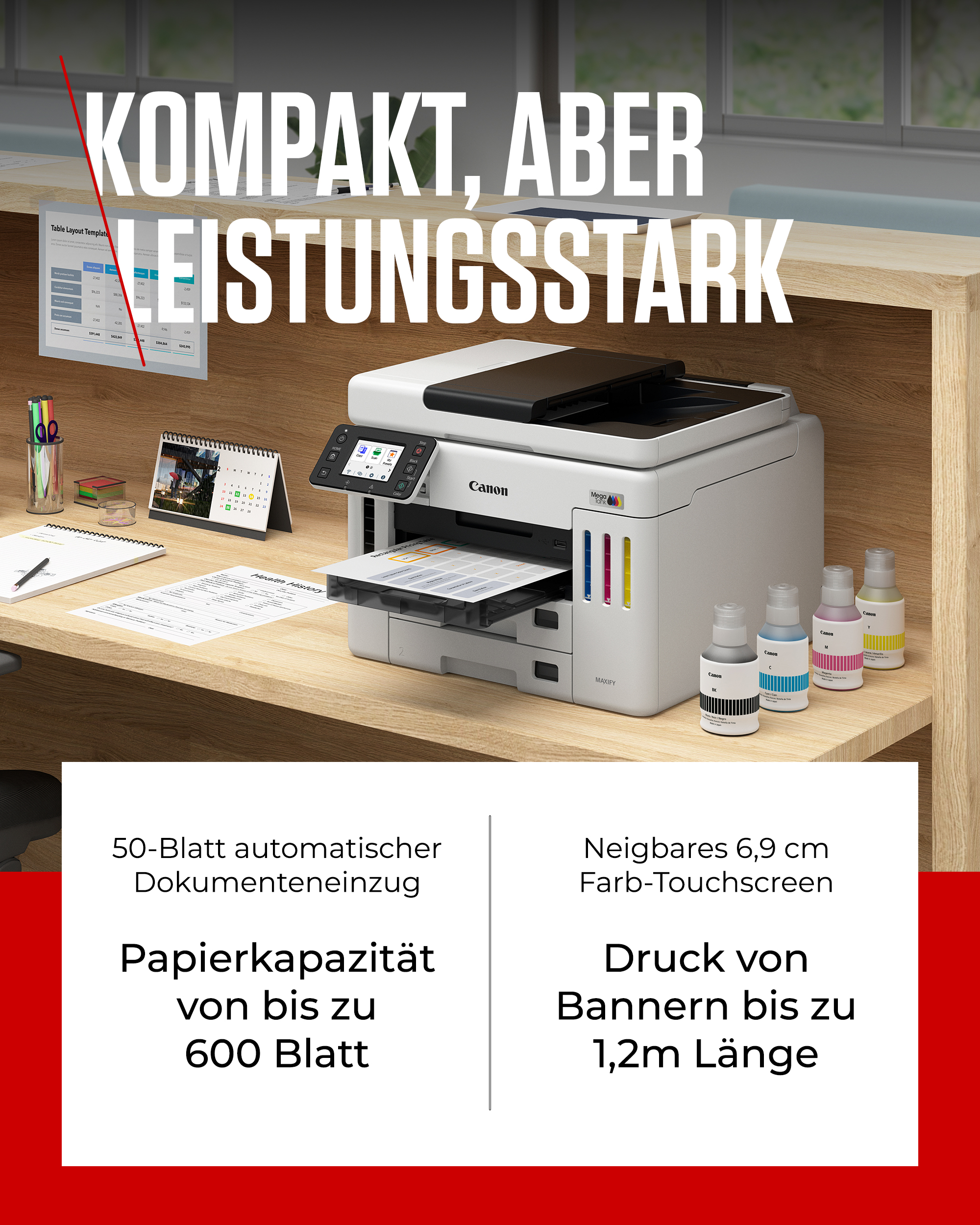 Ein Canon Maxify Drucker steht auf einem Schreibtisch mit Tintenflaschen daneben.
