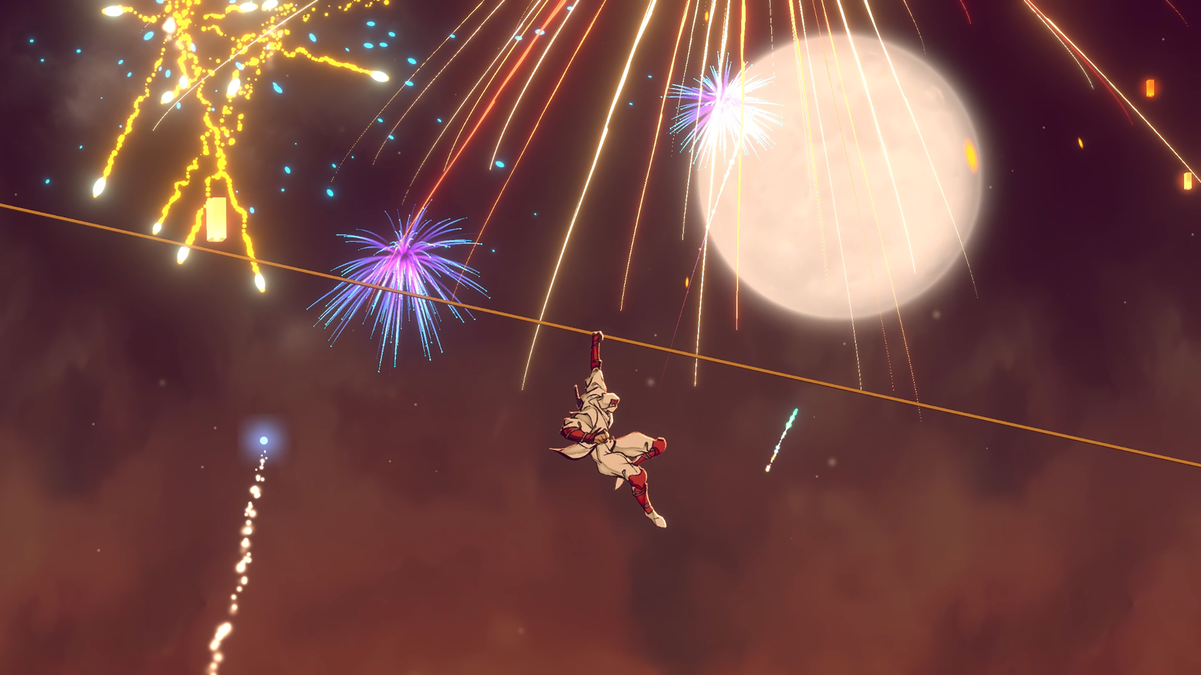 Una figura in bianco e rosso è appesa a una corda mentre i fuochi d'artificio illuminano il cielo notturno.