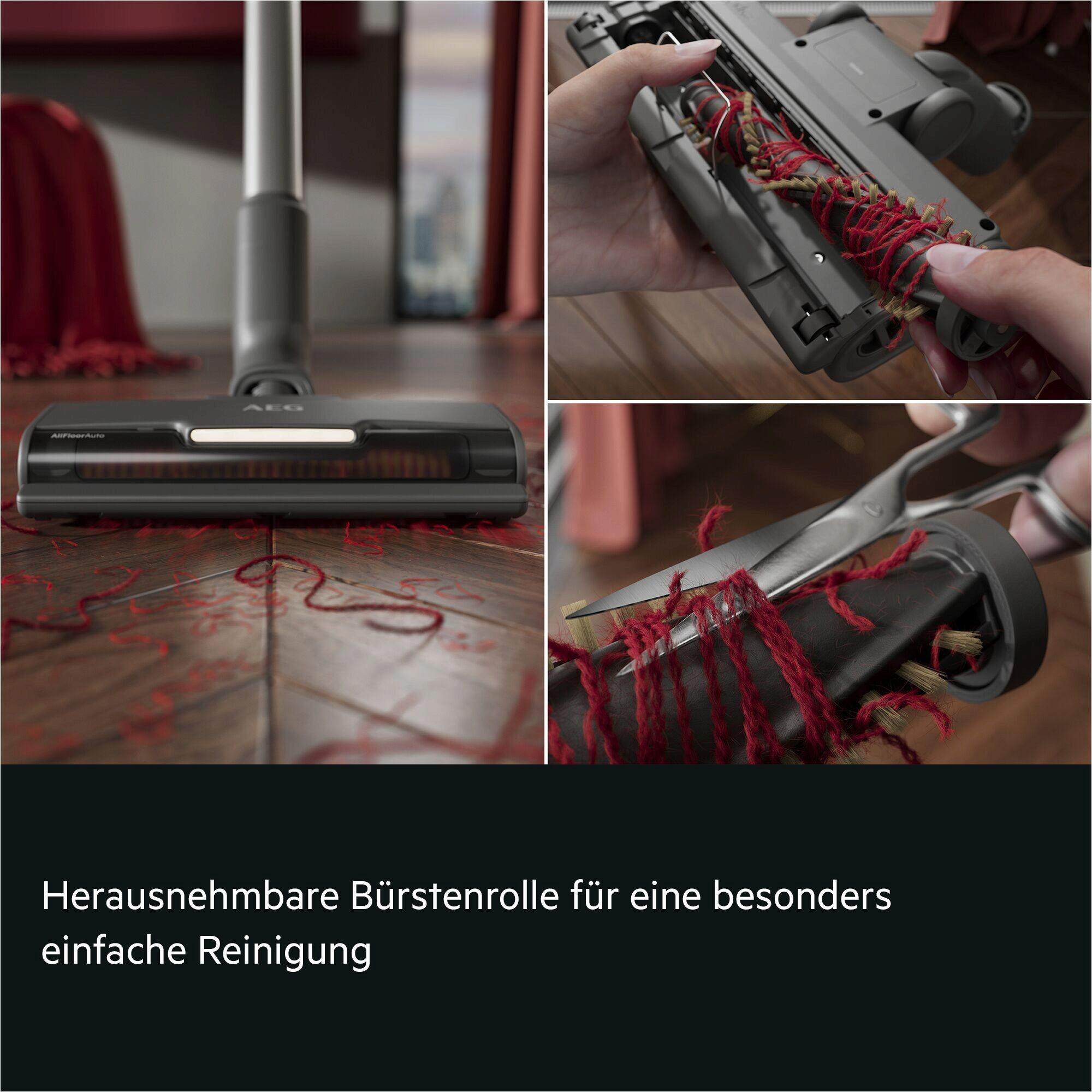 Entwirren einer Staubsaugerbürste mit einer Schere. Holzfußboden.