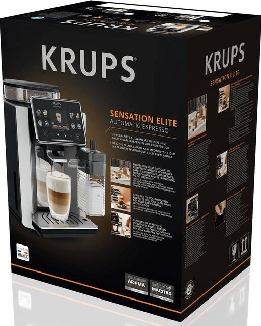 Ekspres automatyczny Krups Sensation Elite na czarnym opakowaniu z kawą w szklance.