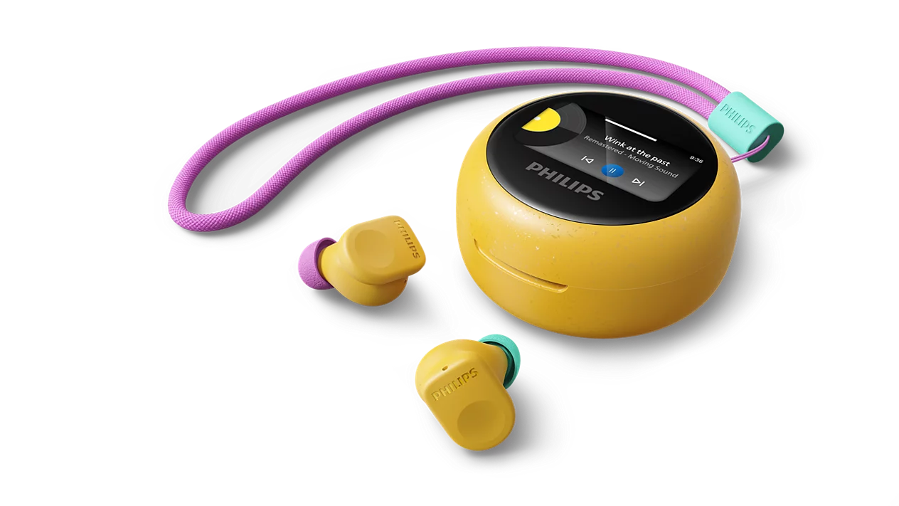 Gelber Philips MP3-Player mit Kopfhörern und lila Schnur auf schwarzem Hintergrund.