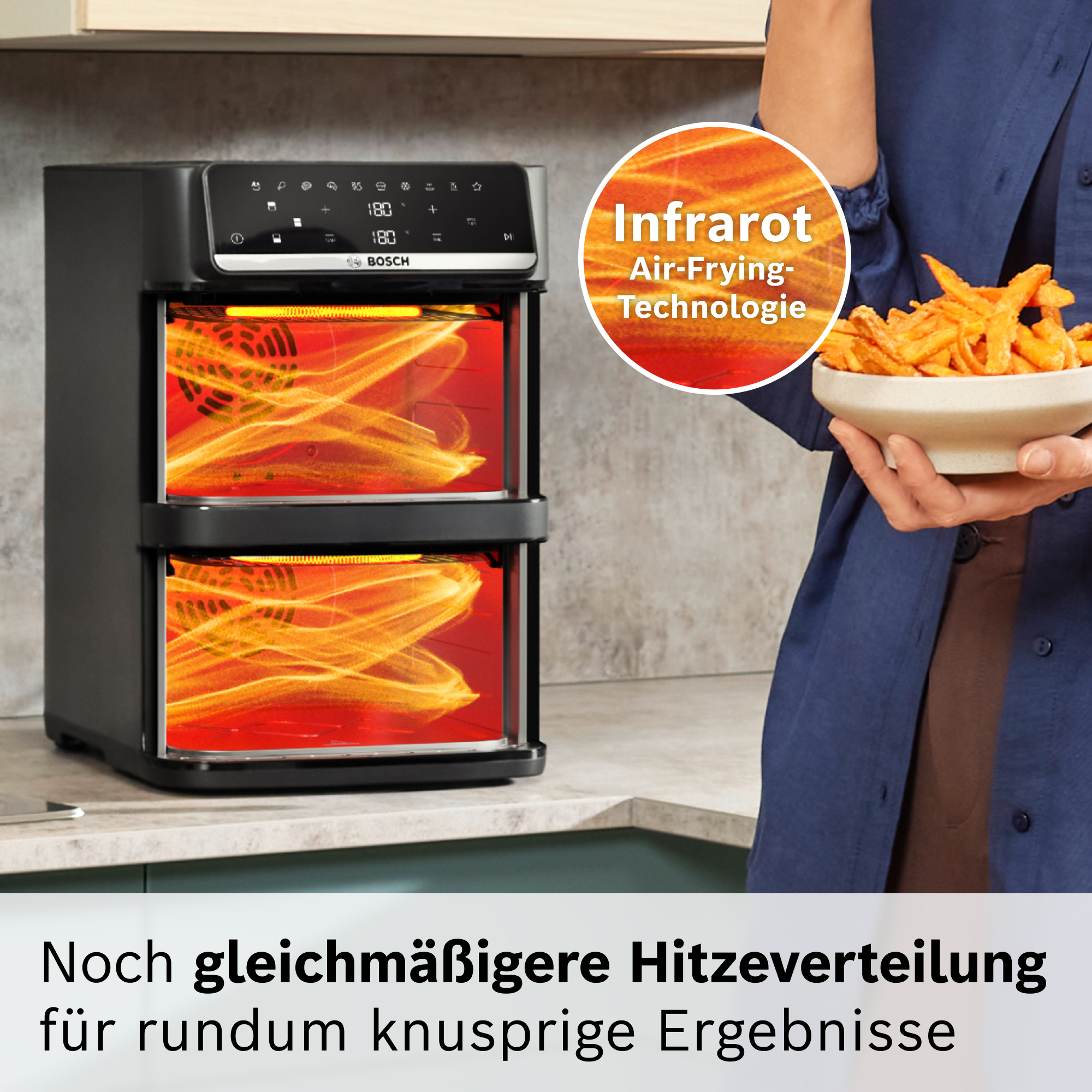Ein Bosch Heißluftfritteuse mit zwei Ebenen und leuchtenden Heizelementen.