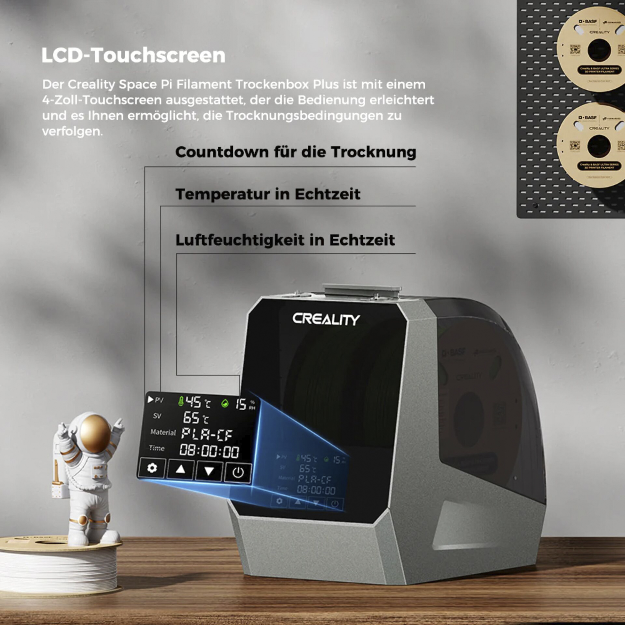Creality Trockenbox mit Astronaut-Figur und Filamentrollen.