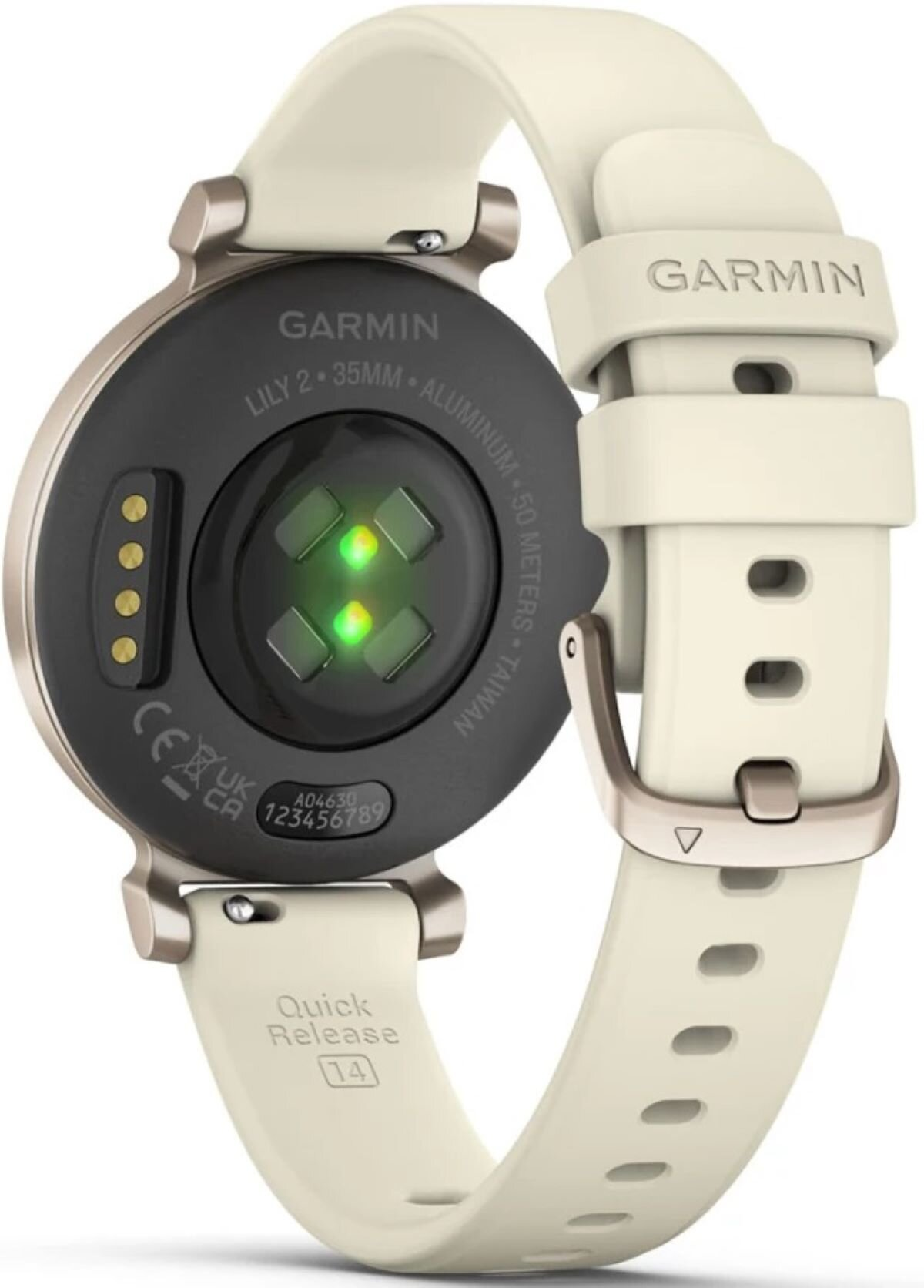 Tył beżowego smartwatcha Garmin Lily 2 z czujnikami, stykami ładowania i napisem na kopercie.