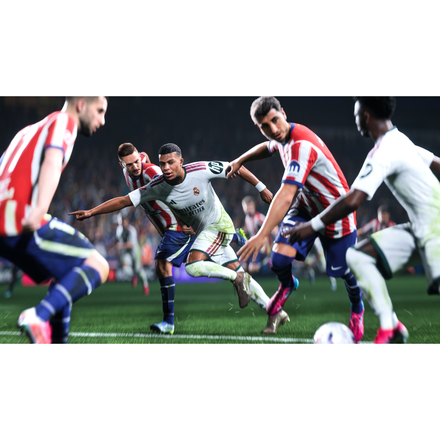 Soccer players in red and white, and white jerseys compete for the ball on a green field.