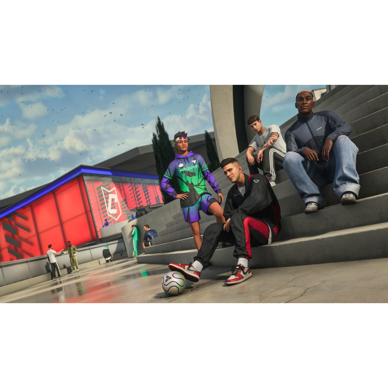 Four young men sit on stairs with a soccer ball. A red building is in the background.