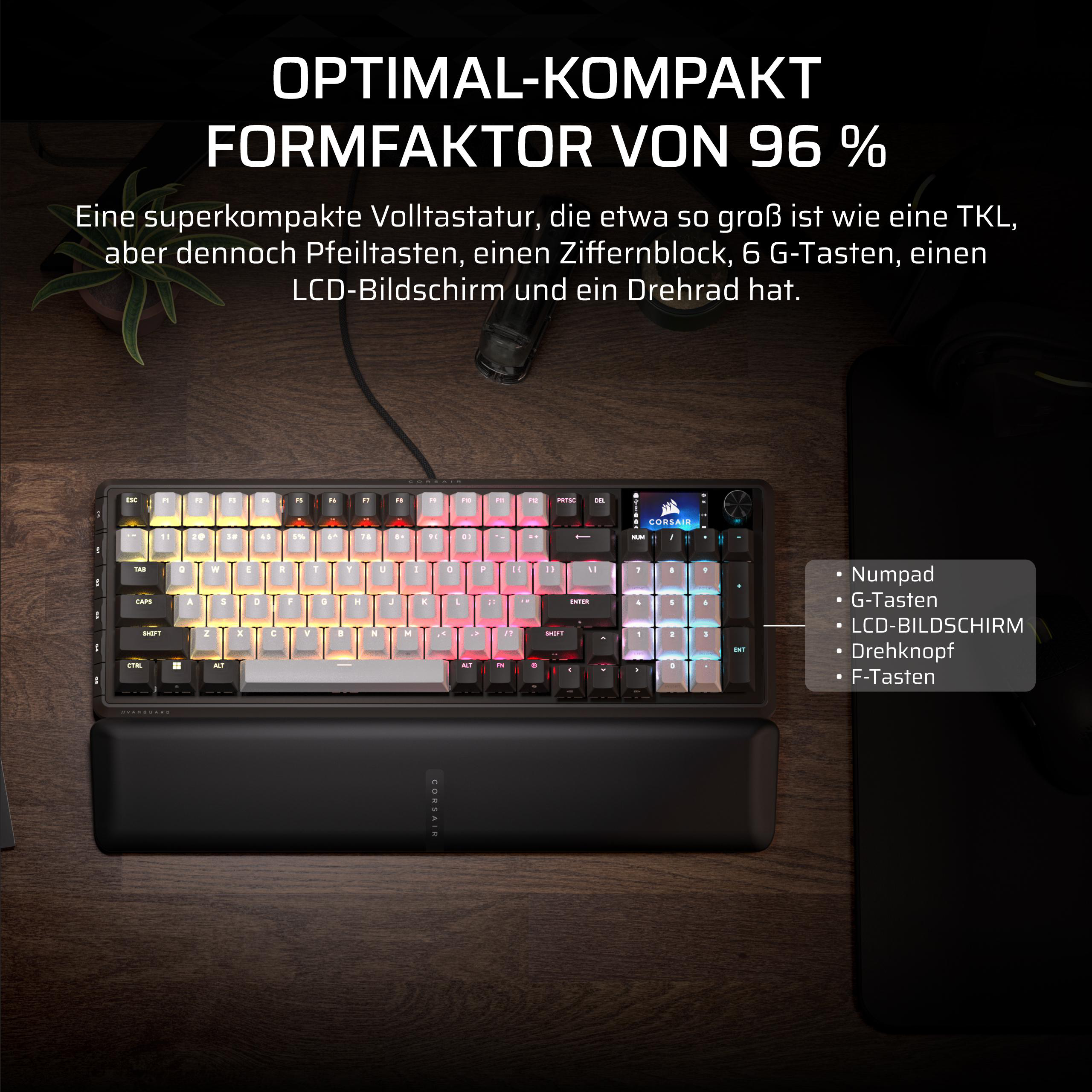 Eine kompakte Tastatur mit RGB-Beleuchtung, LCD und Drehrad auf einem Holztisch.