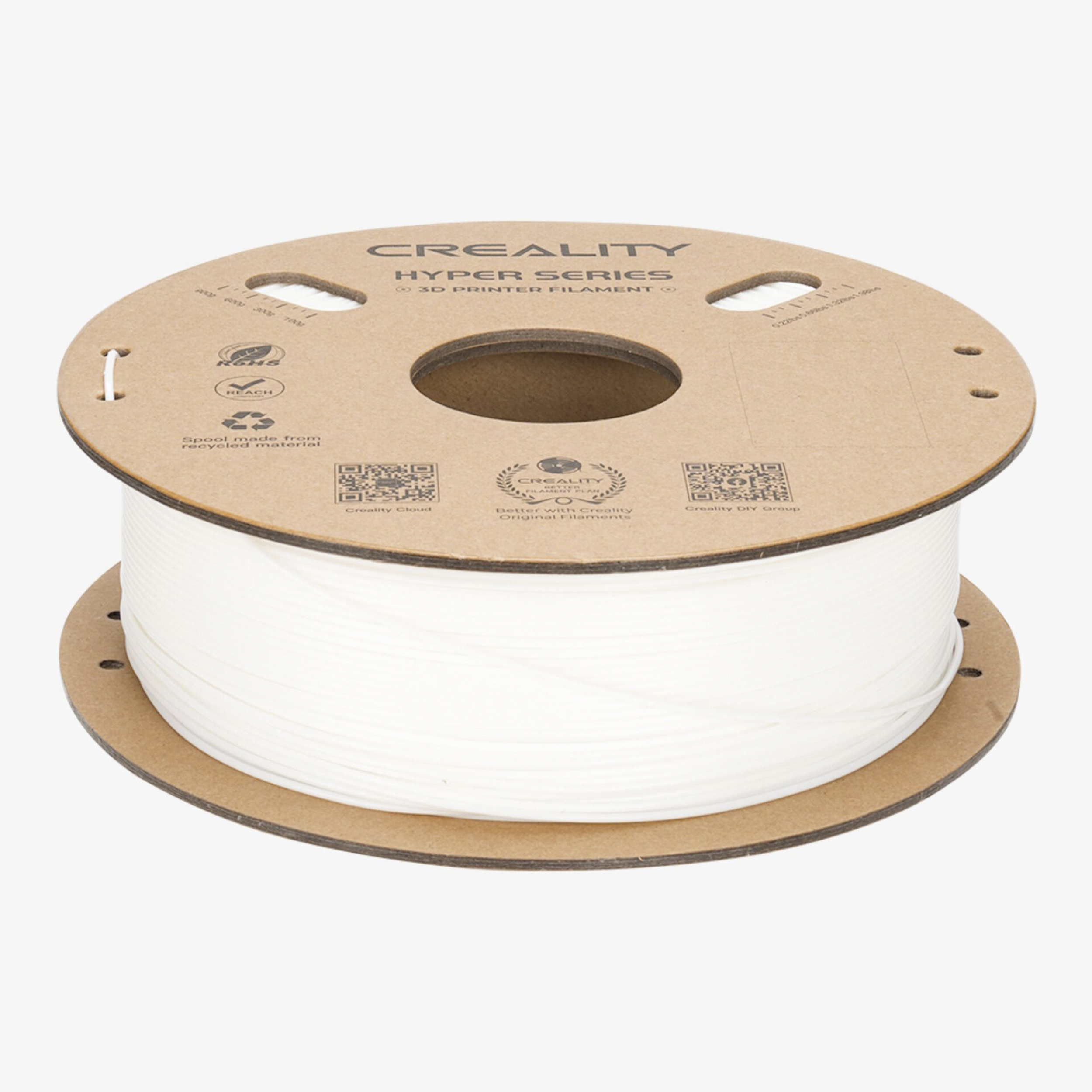 Eine Spule weißen 3D-Druckerfilaments von Creality auf braunem Karton.