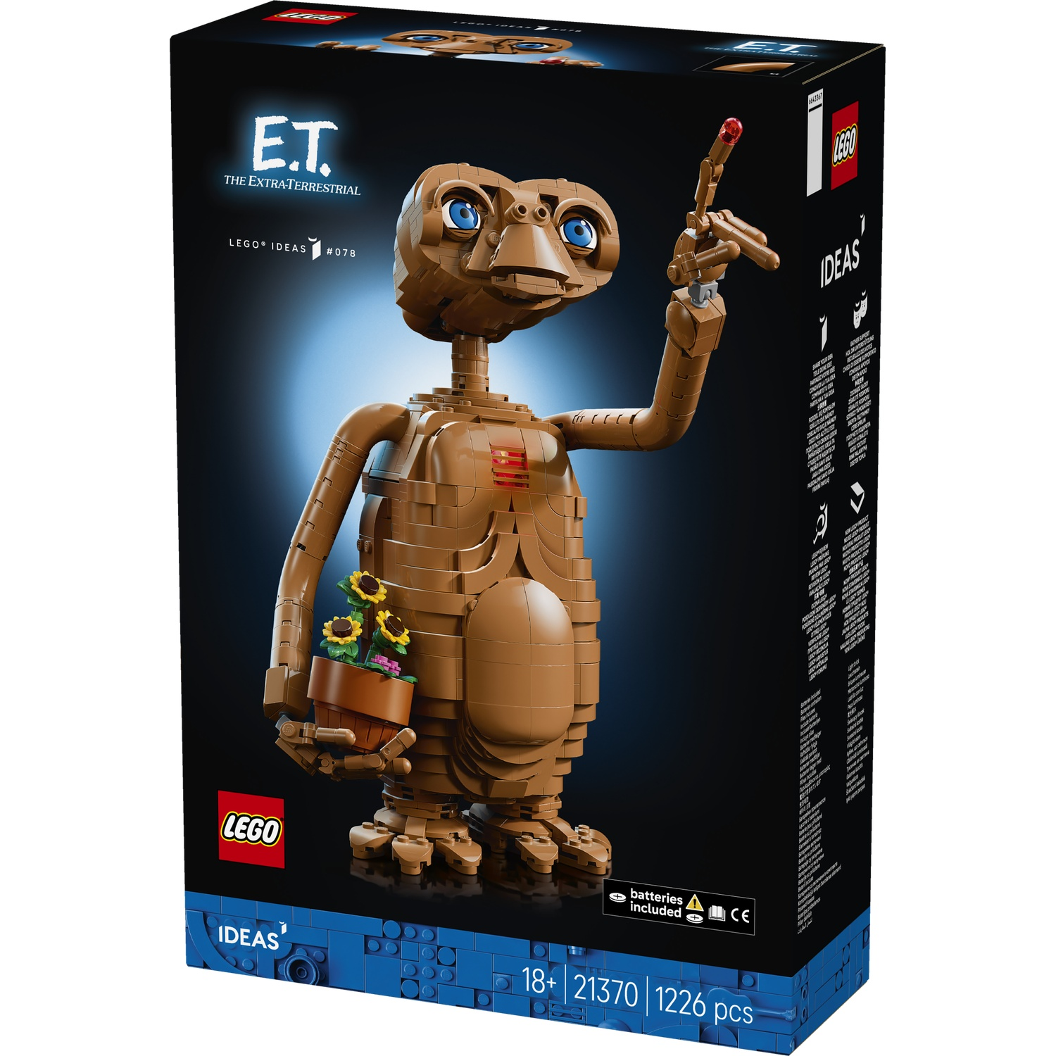 LEGO E.T. met plantenpot, vinger verlicht, op zwarte achtergrond.