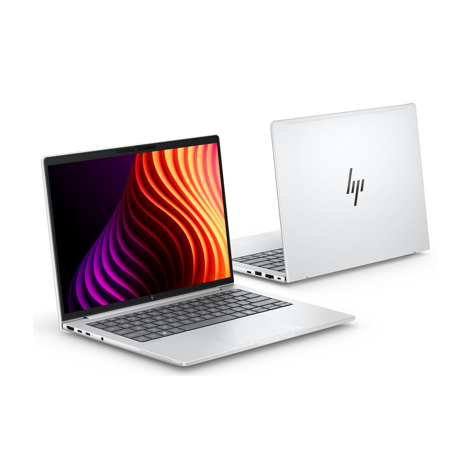 Due laptop HP argentati su sfondo bianco. Uno è aperto e mostra uno sfondo colorato.