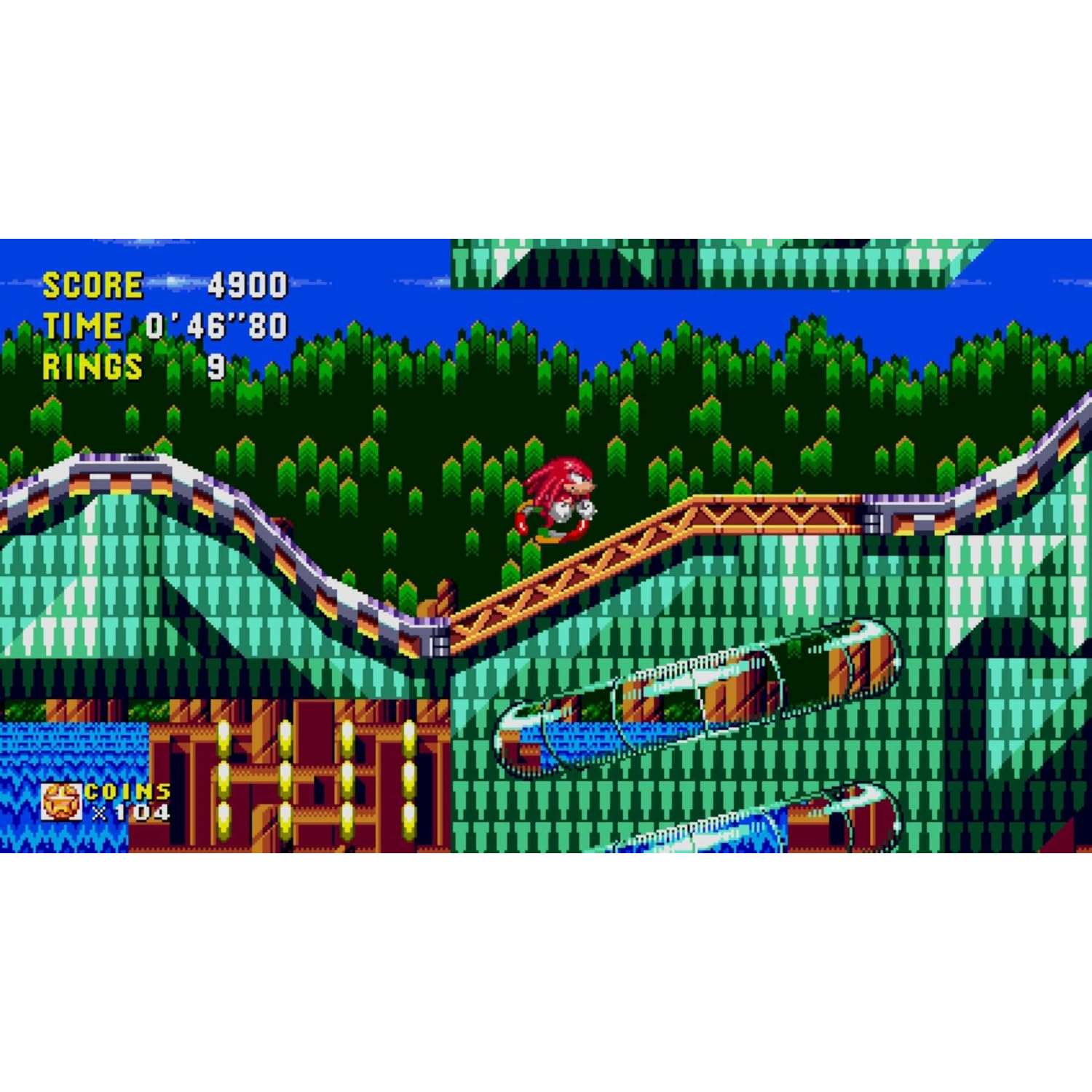 Knuckles rent op een baan met groene bomen en blauw water op de achtergrond.