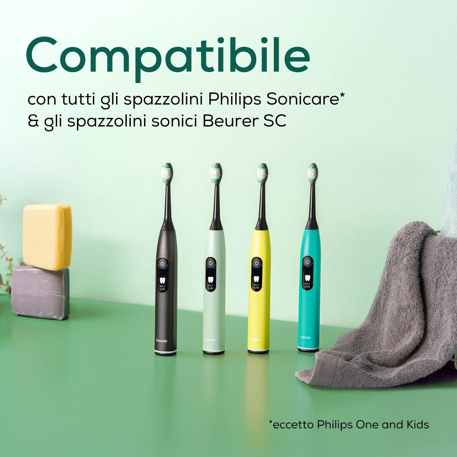 Quattro spazzolini elettrici neri, verde chiaro, gialli e turchesi.