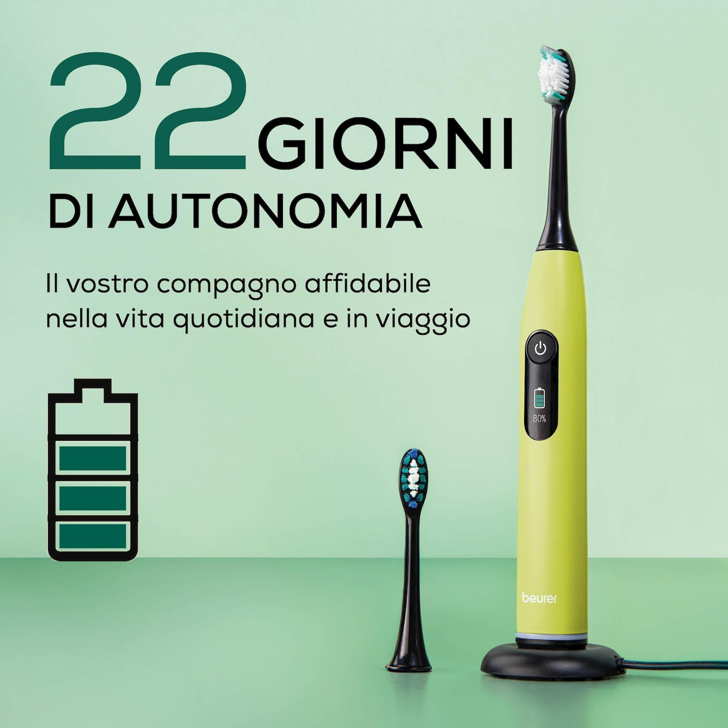 Spazzolino elettrico verde con indicatore di carica e testina di ricambio. Testo: 22 giorni autonomia.