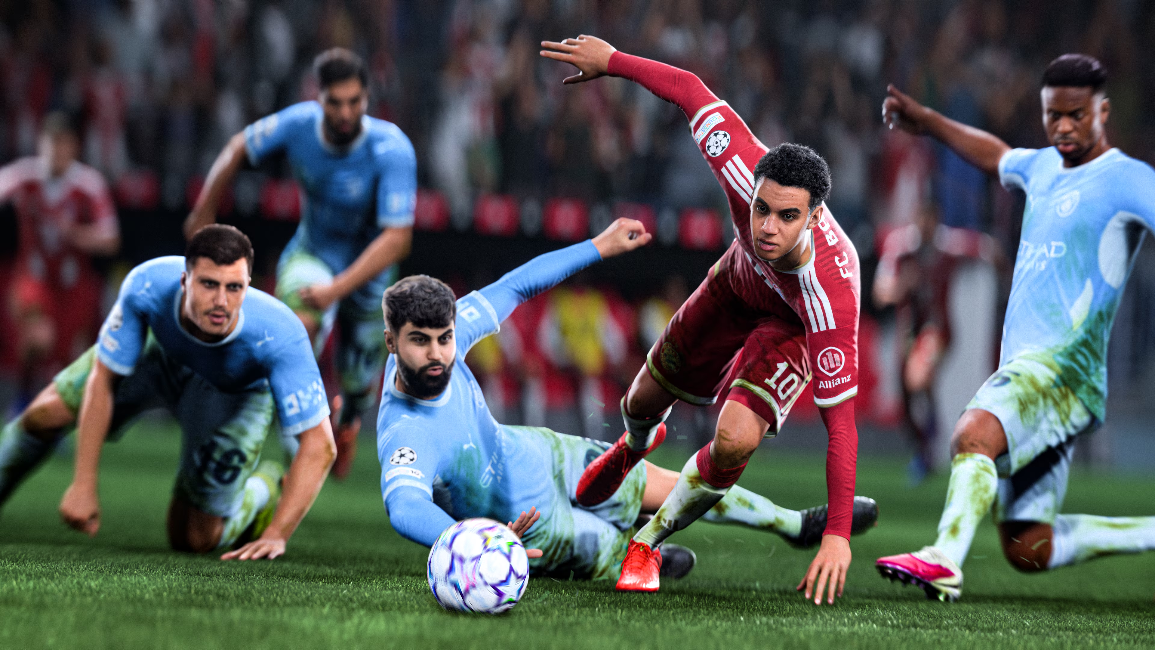 Calciatori in maglia rossa e blu lottano per la palla su un campo.