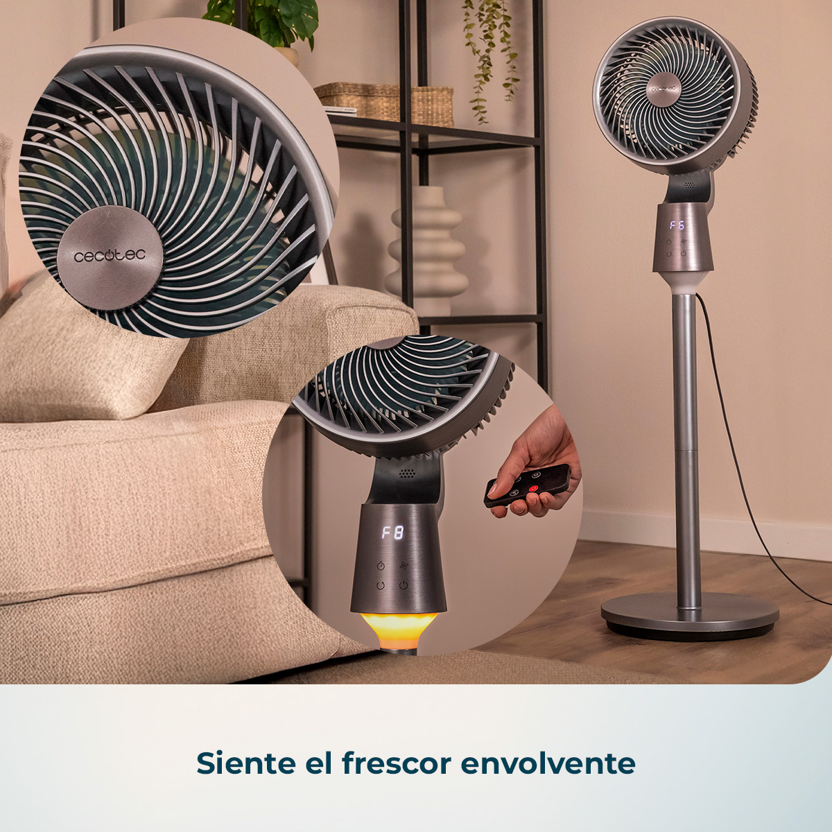 Ventilador de pie gris en una sala con control remoto.