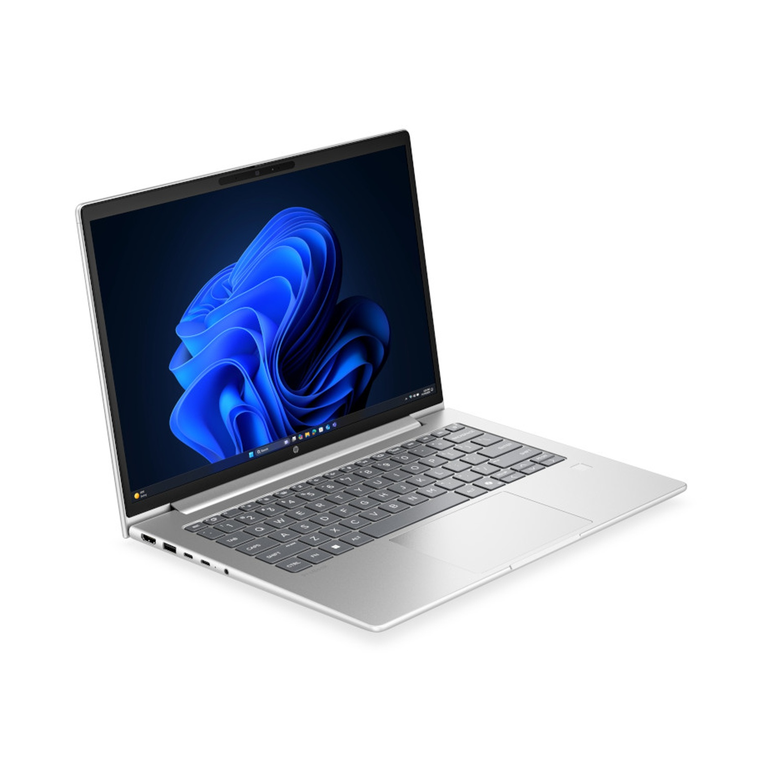 Un computer portatile argentato su sfondo bianco mostra un motivo a onde blu astratte.