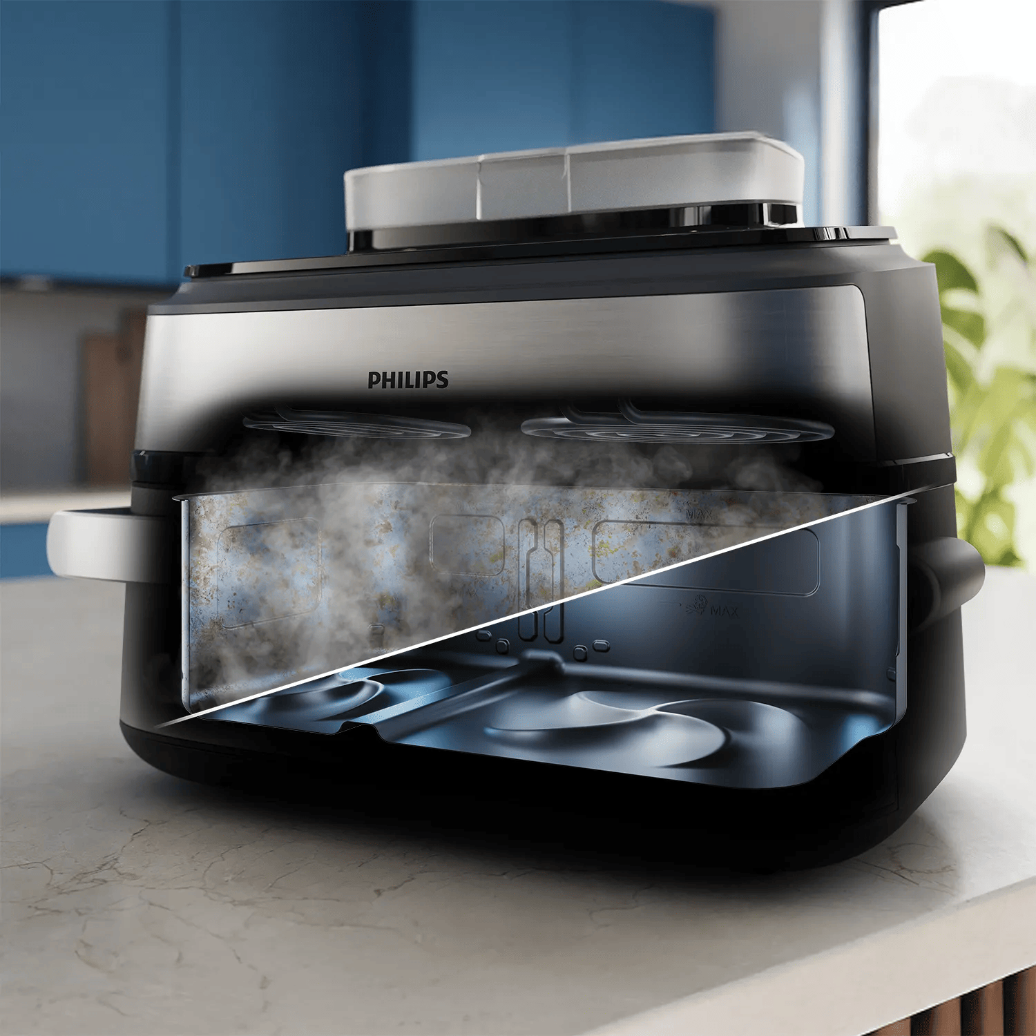 Coupe transversale d'une friteuse à air Philips noire avec fonction vapeur sur un plan de travail.