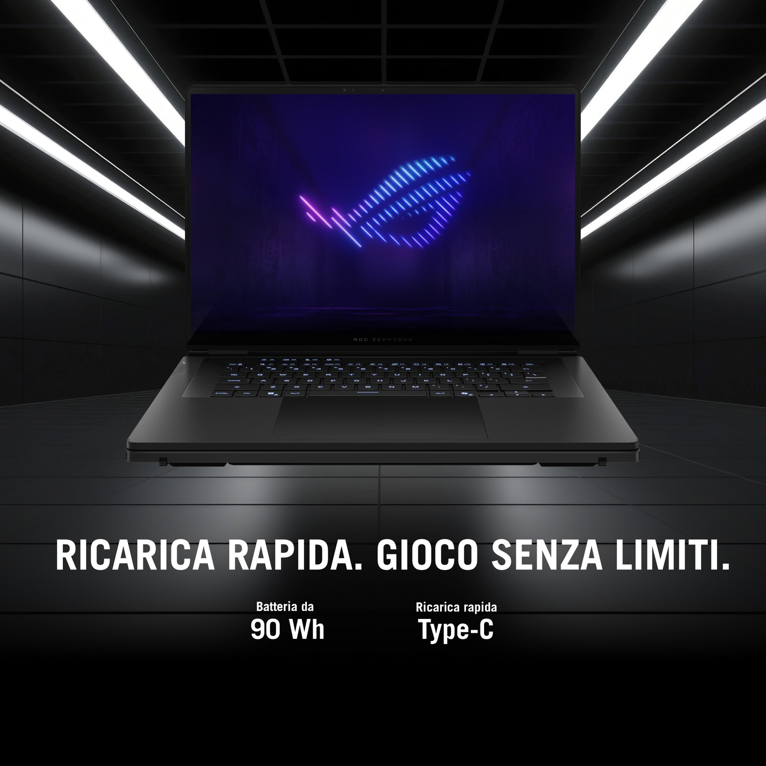 Un laptop da gioco nero fluttua in una stanza buia con luci sul soffitto e testo in basso.