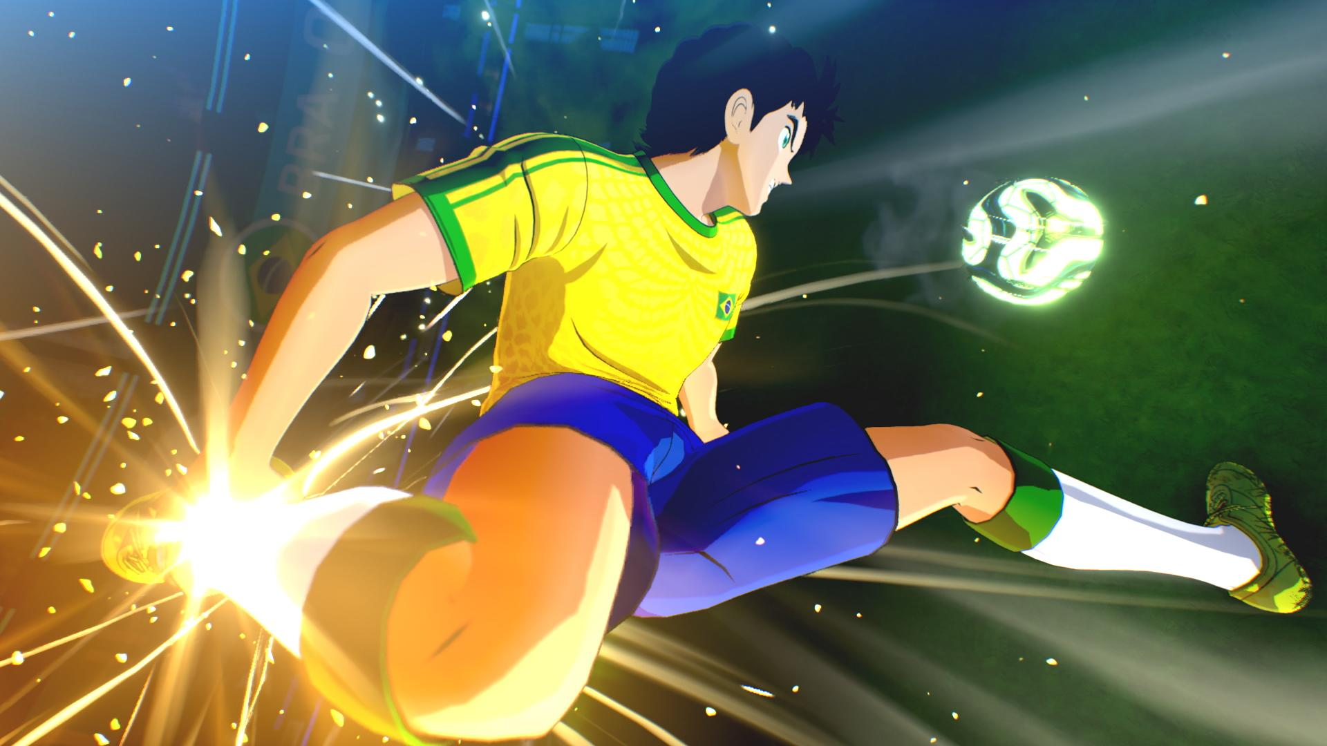 Ein Anime-Fußballspieler in gelb-blauem Trikot tritt kraftvoll gegen einen leuchtenden Ball auf dem Spielfeld.