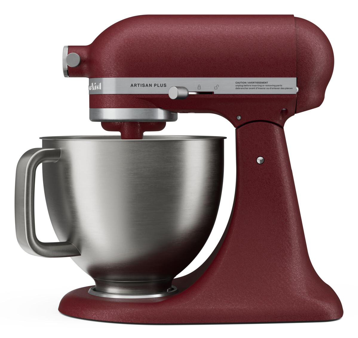 Rote Küchenmaschine Artisan Plus mit Edelstahlschüssel auf weißem Hintergrund.