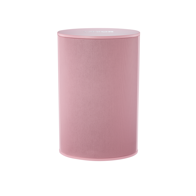 Ein zylindrischer, pinker Lautsprecher mit Metallgitter auf schwarzem Hintergrund.