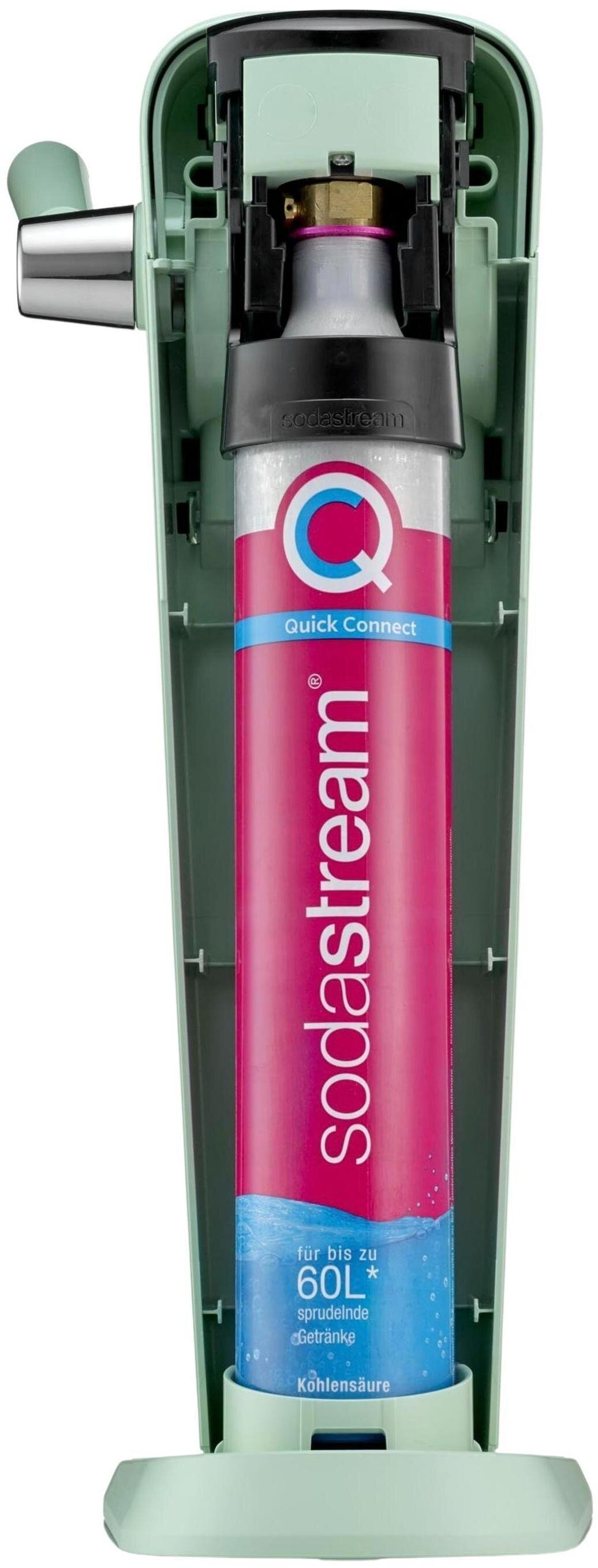 Różowy cylinder CO2 SodaStream jest włożony w zieloną obudowę saturatora do wody.