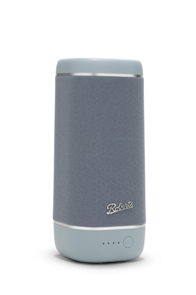 Ein grauer zylindrischer Bluetooth-Lautsprecher der Marke Roberts mit Metallakzenten vor schwarzem Hintergrund.