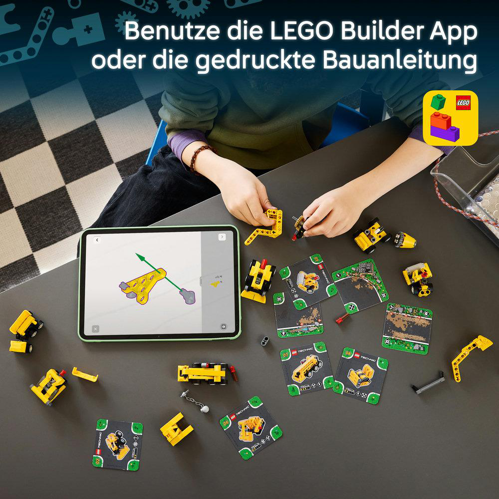 Ein Kind baut Lego Technic, unterstützt von einer Tablet-App auf einem dunklen Tisch mit Bauanleitungen.