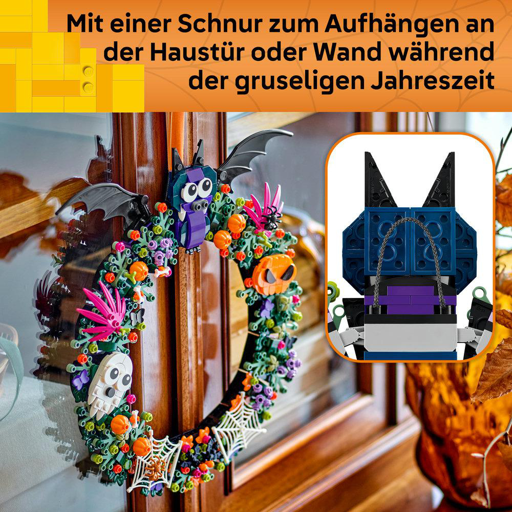 Lego-Halloween-Kranz mit Schnur, verziert mit Fledermaus, Kürbissen und Spinnenweben.