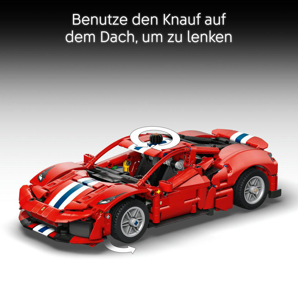 Roter Lego-Sportwagen mit Textanleitung oben, die zeigt, wie man mit dem Knopf auf dem Dach lenkt.
