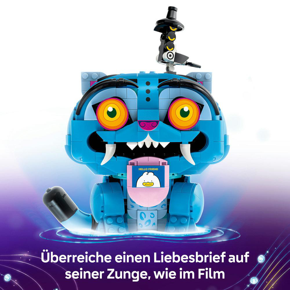 Ein blauer Lego-Tiger mit leuchtend gelben Augen, scharfen weißen Reißzähnen und einer rosa Zunge.