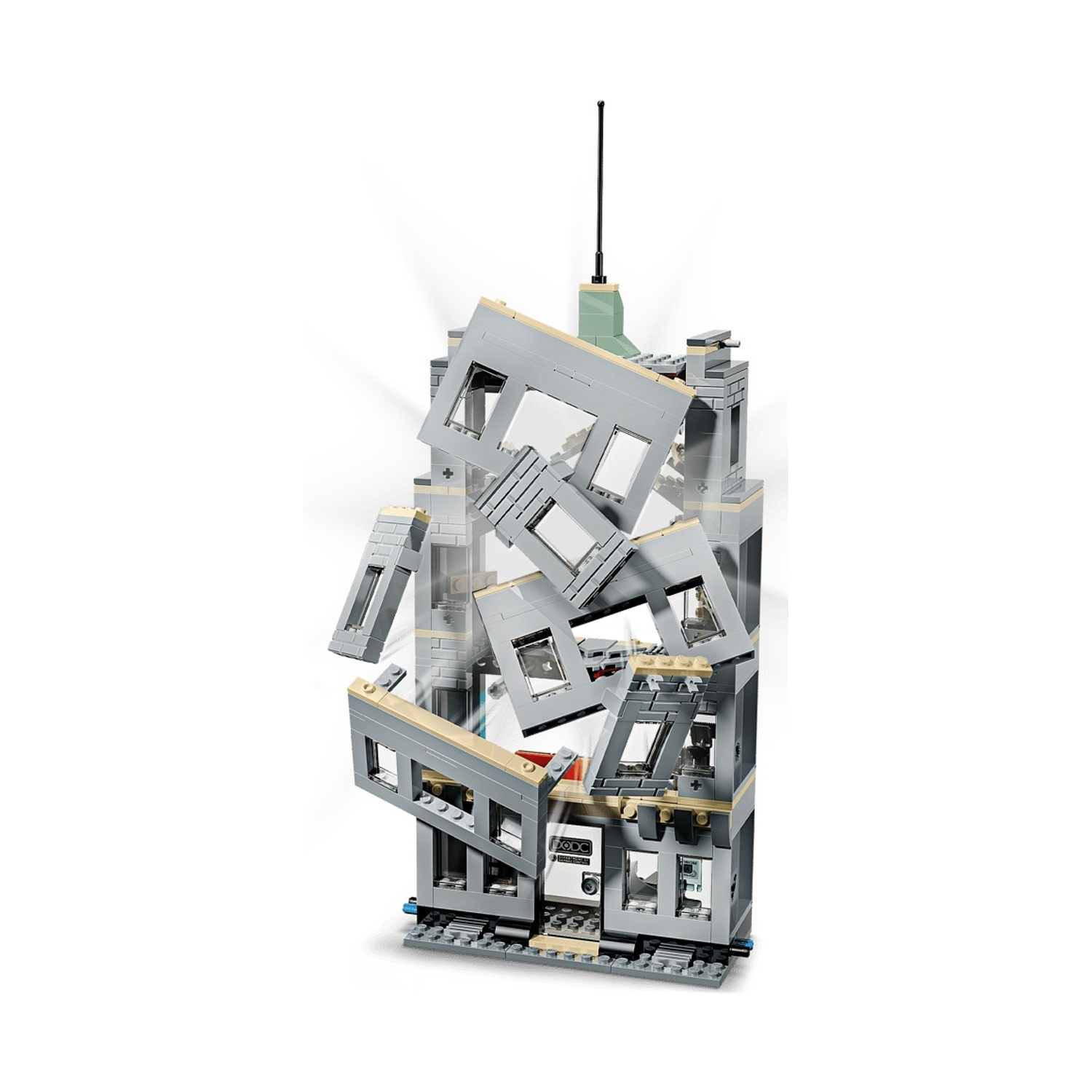 Un modello di edificio Lego grigio con pareti che esplodono e cadono verso l'esterno.