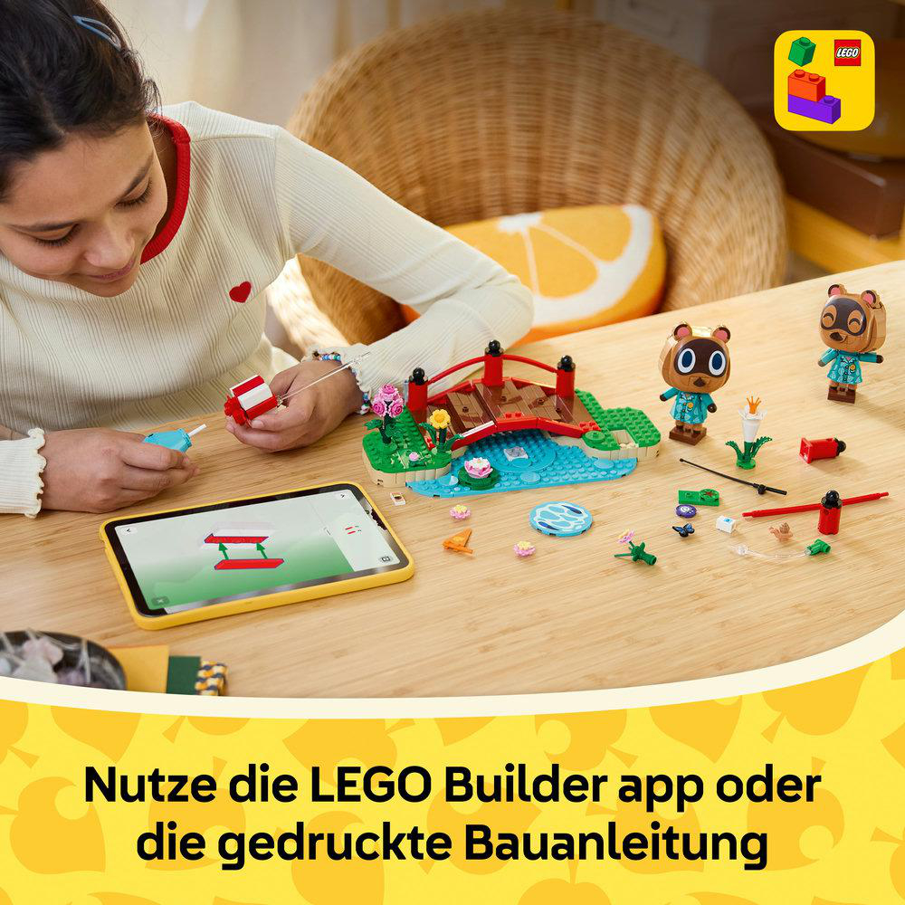 Ein Mädchen baut ein LEGO Animal Crossing Set, unterstützt von einer Tablet-App.