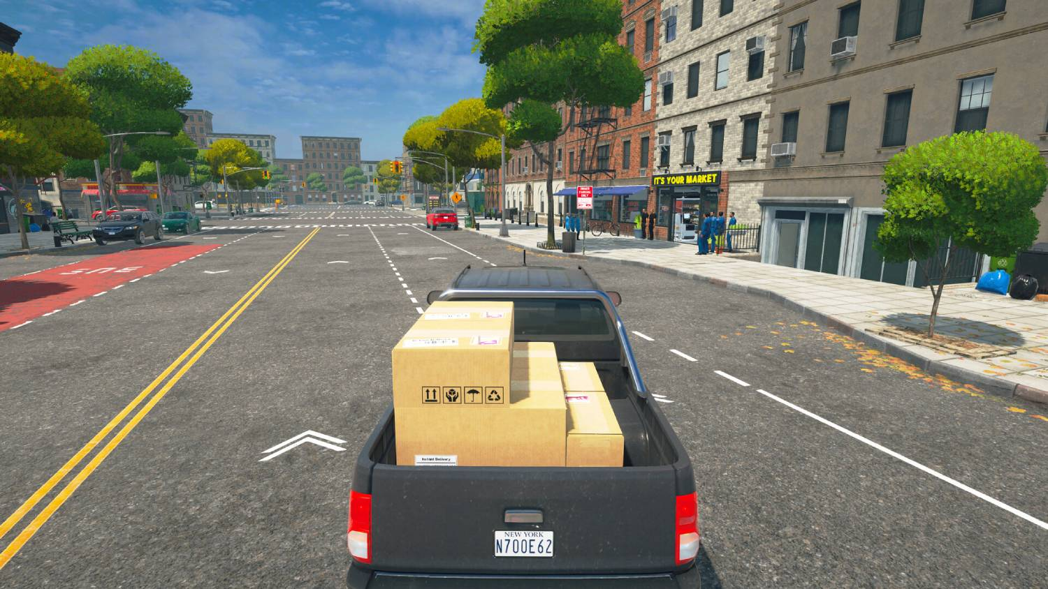 Una camioneta negra con cajas de cartón en la cajuela conduce por una calle vacía.