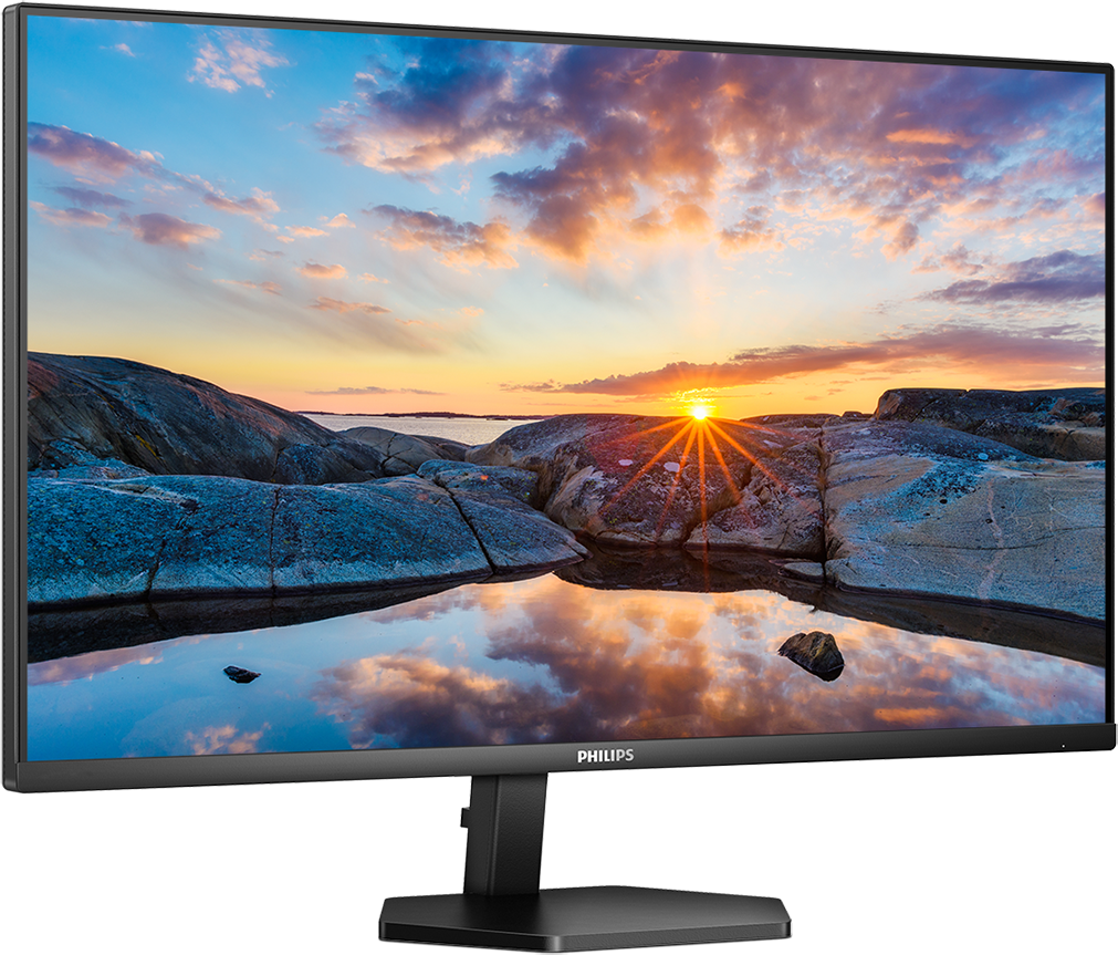 Vékony kávás Philips monitor naplementét mutat egy sziklás tengerparton.