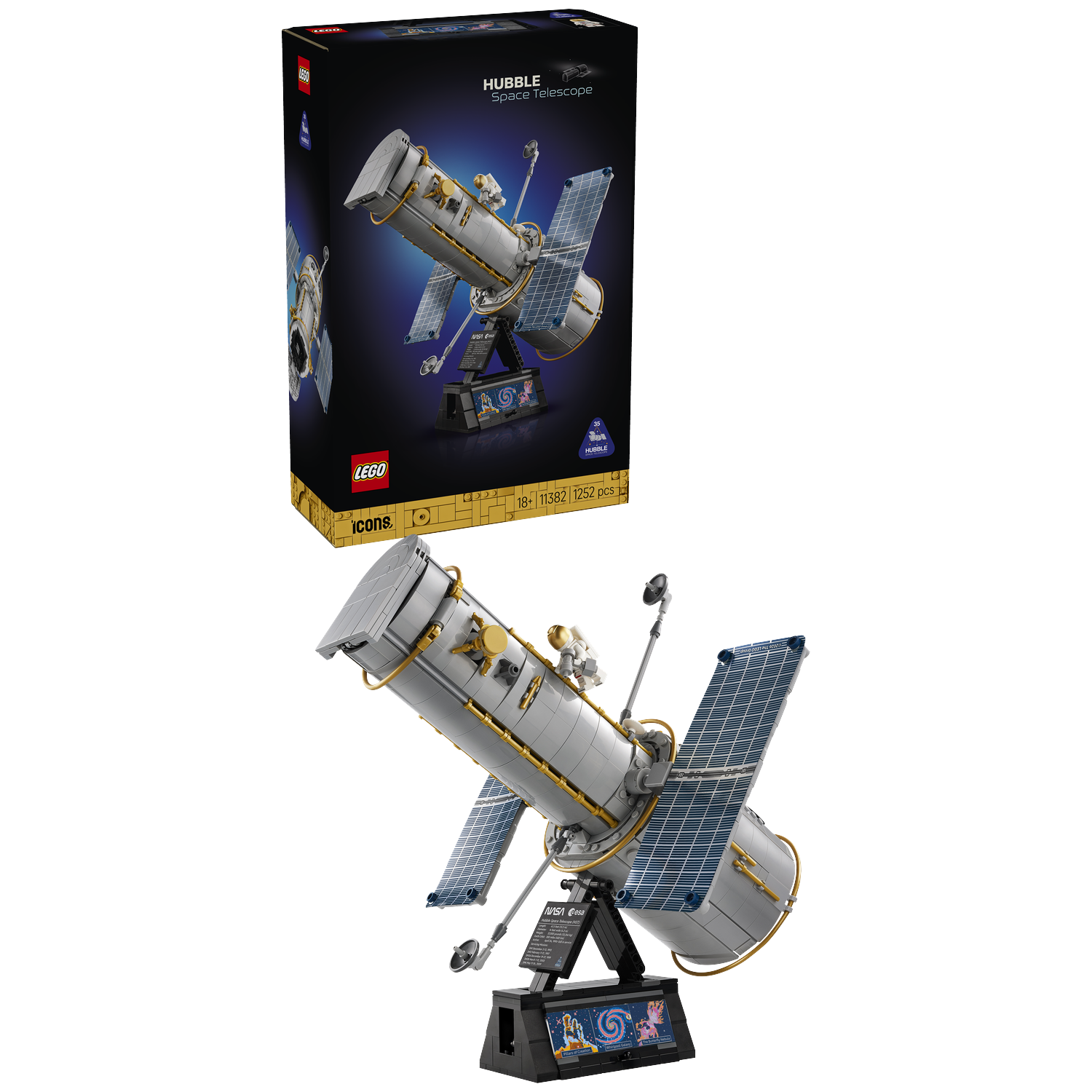 A Lego model of the Hubble Space Telescope on a stand, with its box shown above against a black background.