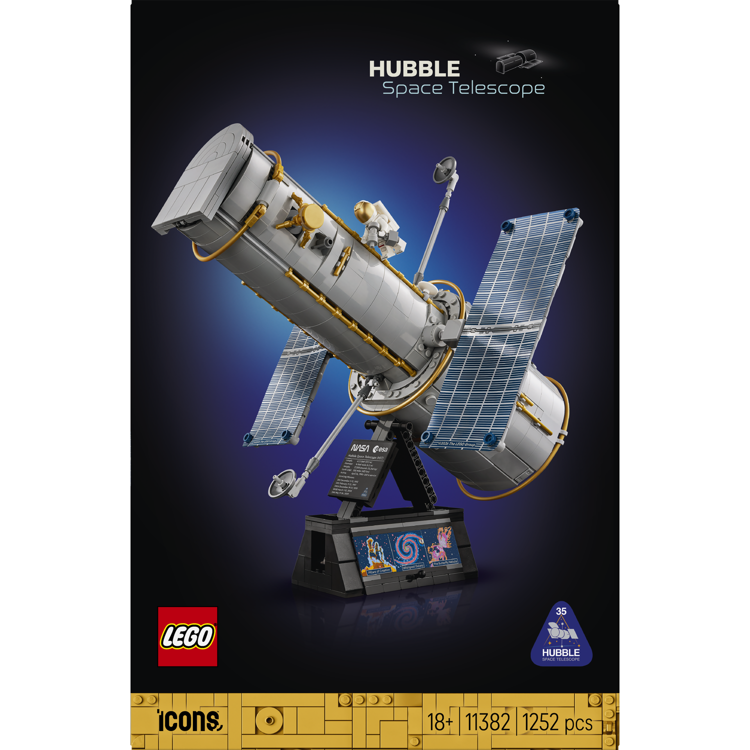 Lego Hubble Space Telescope on a black stand with blue solar panels against a dark background.