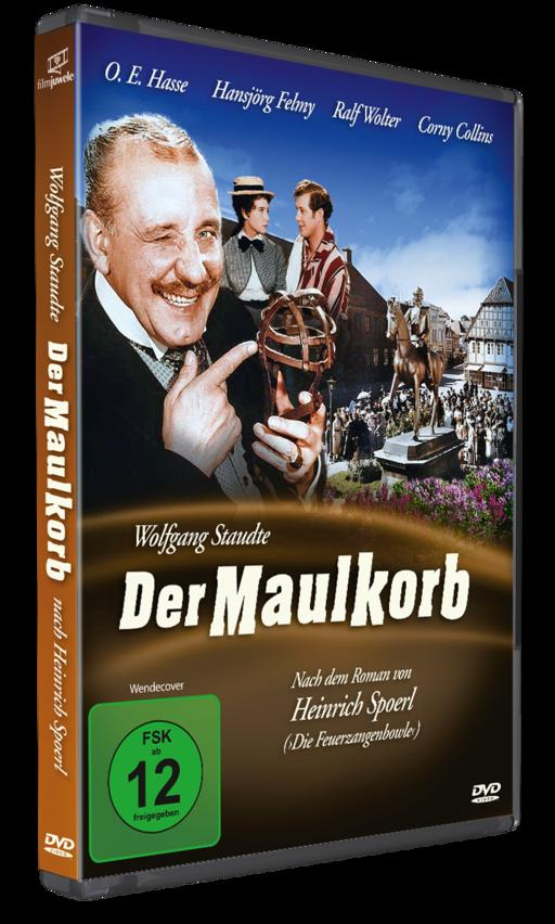 DVD-Hülle des Films Der Maulkorb mit einem Schauspieler, der lächelt und auf einen Maulkorb zeigt, vor einer historischen Straßenszene.
