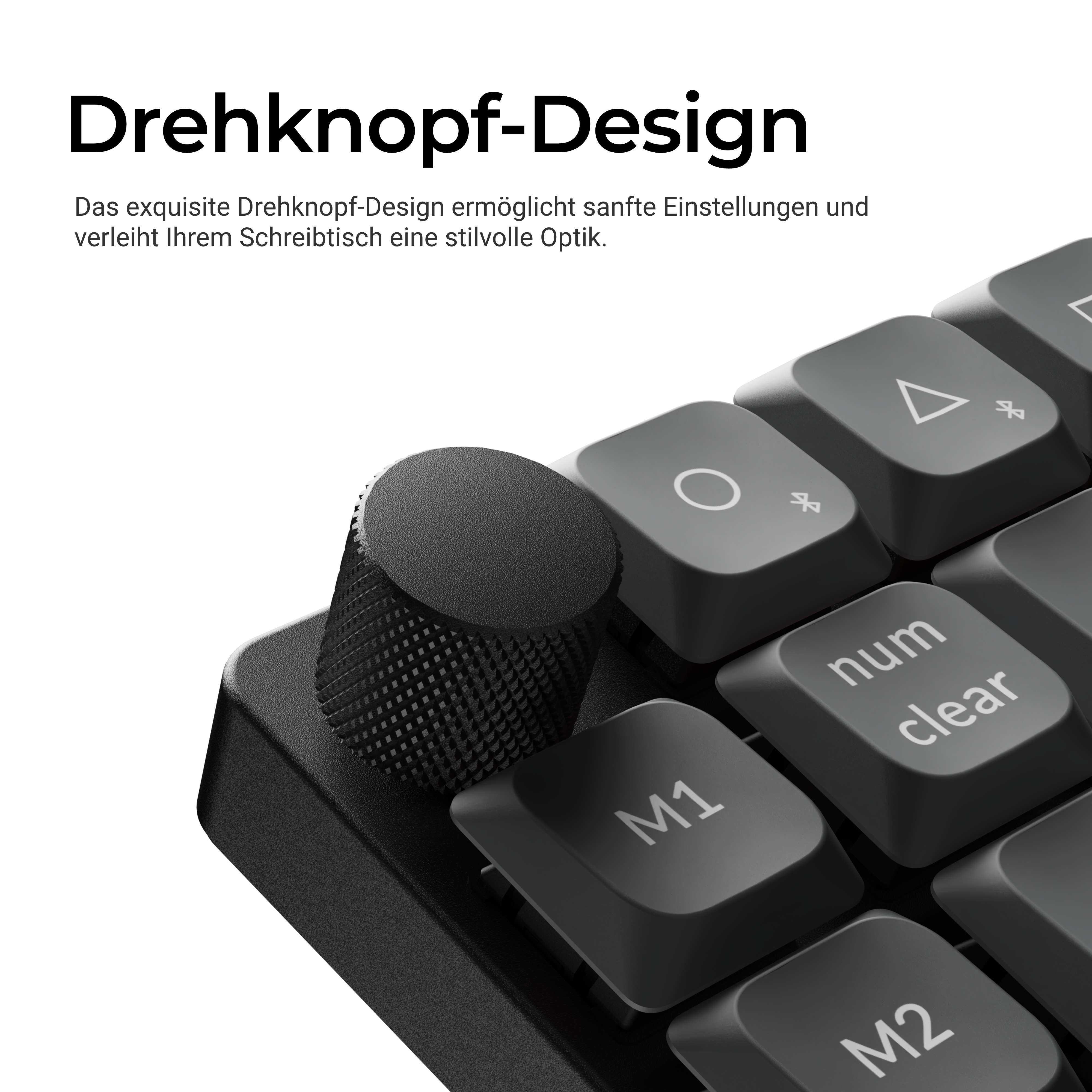 Nahaufnahme einer schwarzen Tastatur mit einem strukturierten Drehknopf und Tasten wie M1 und num clear.