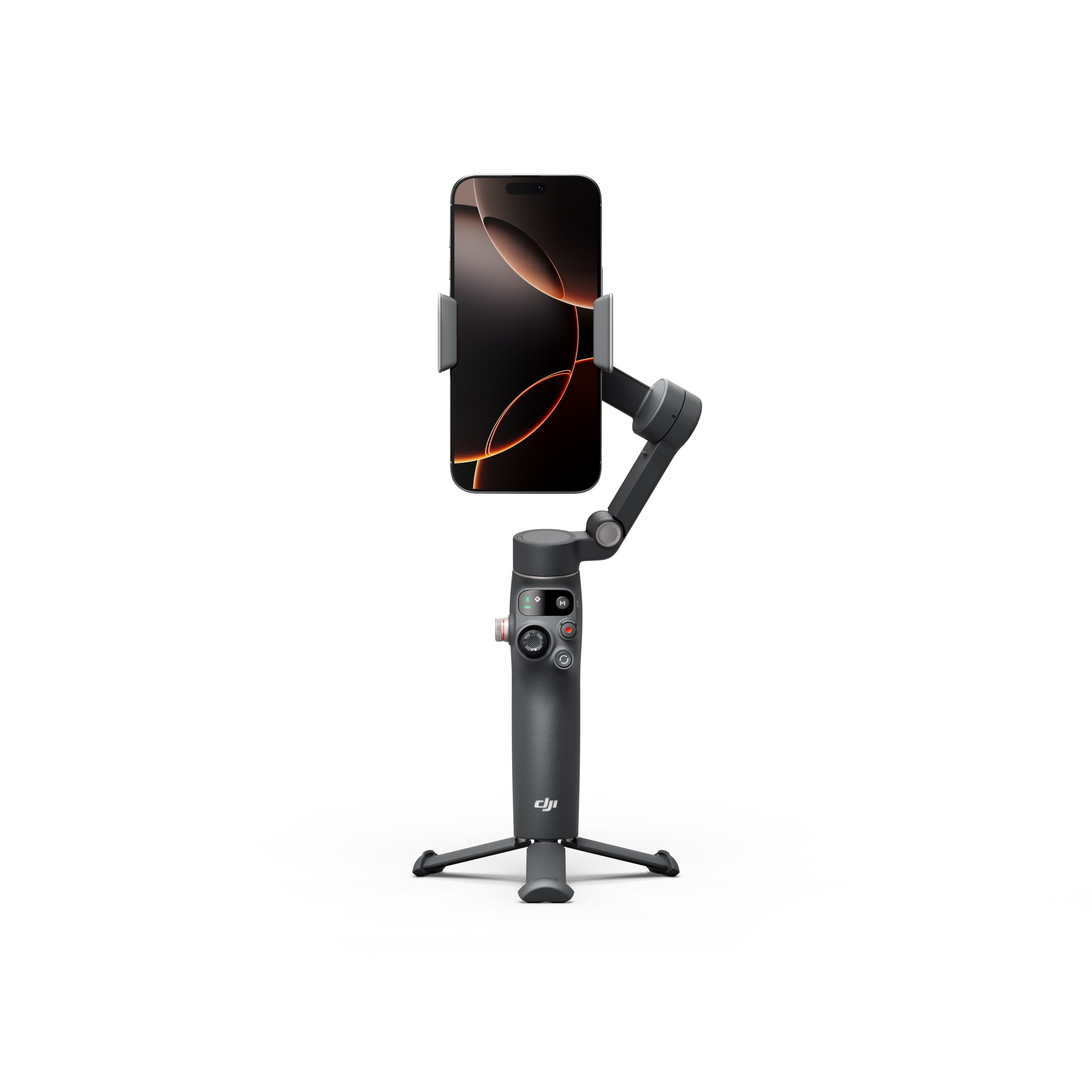 Beyaz arkaplanda küçük bir tripod üzerinde duran, telefonu tutan gri akıllı telefon sabitleyicisi.