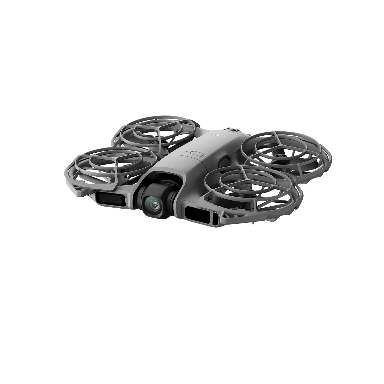 Un dron gris de DJI con cuatro protectores de hélice integrados y una cámara frontal sobre un fondo negro.