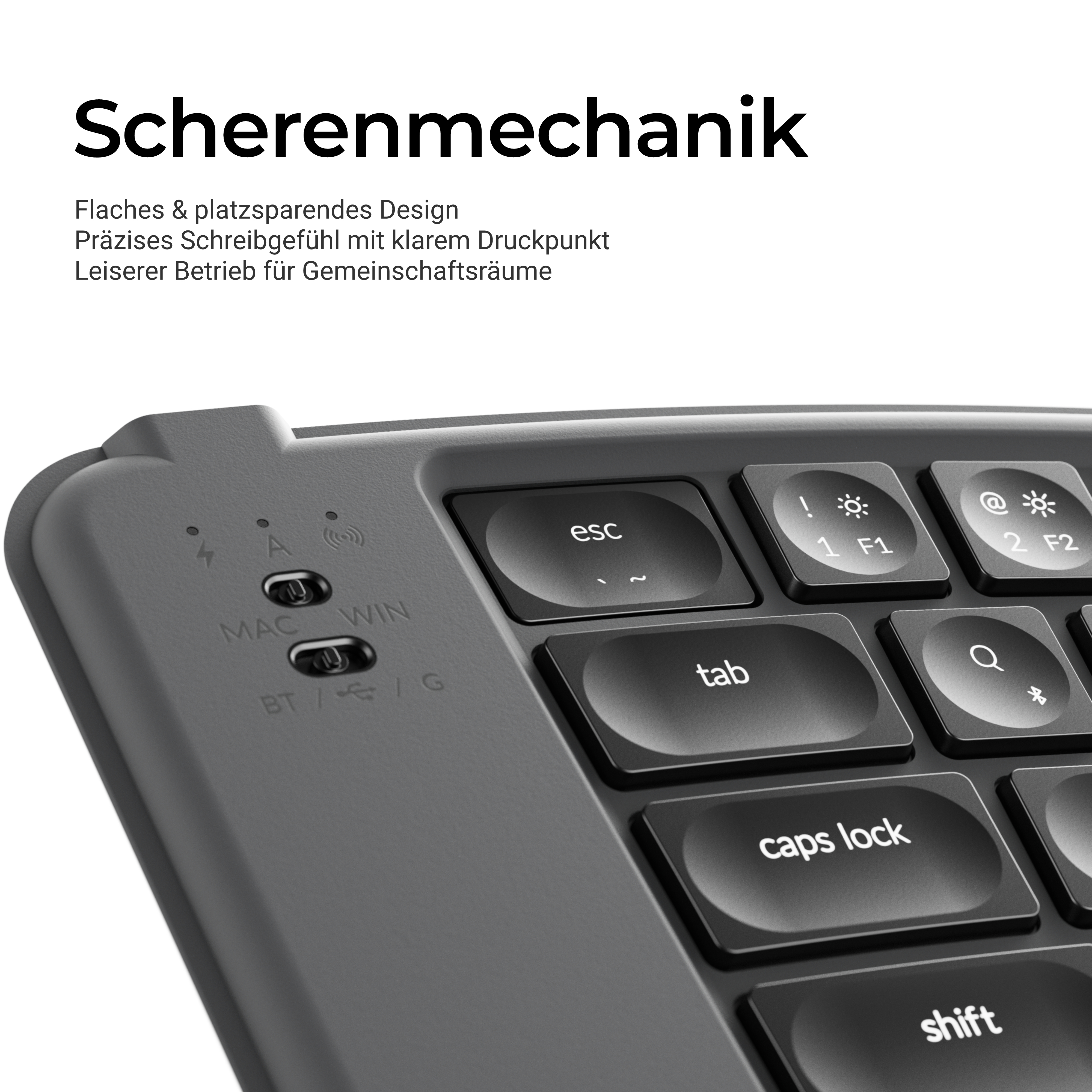 Nahaufnahme einer grauen Tastatur mit runden Tasten und deutscher Textüberlagerung über Scherenmechanik.