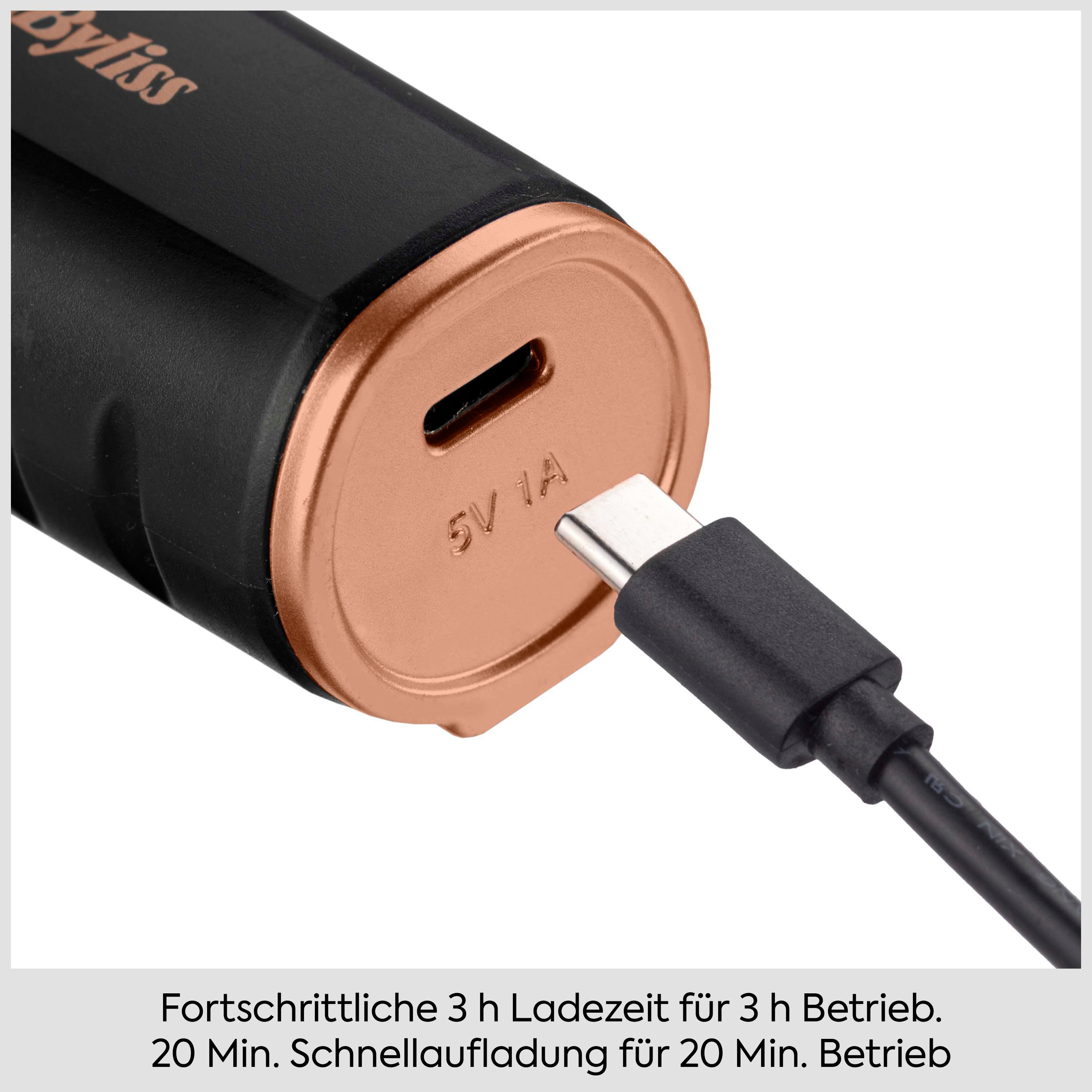 Ein schwarzes Gerät mit roségoldenem Boden und USB-C-Kabel, das aufgeladen wird.