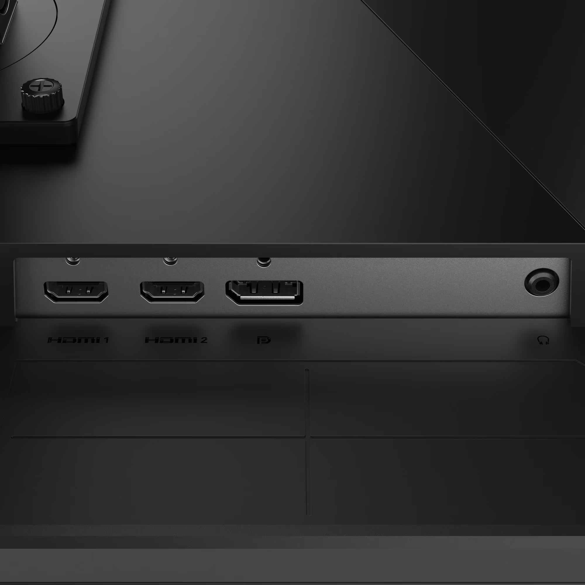 A monitor hátlapjának közeli képe, amely két HDMI-portot, egy DisplayPortot és egy audiojack-et mutat.