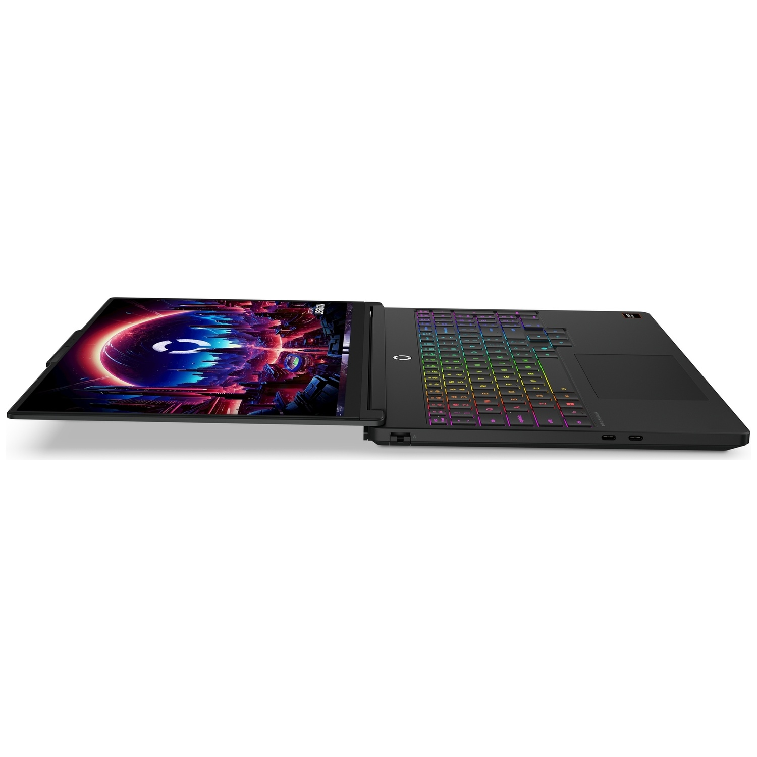 A black gaming laptop lies flat on a white surface, displaying a colorful fantasy landscape screen and RGB keyboard.