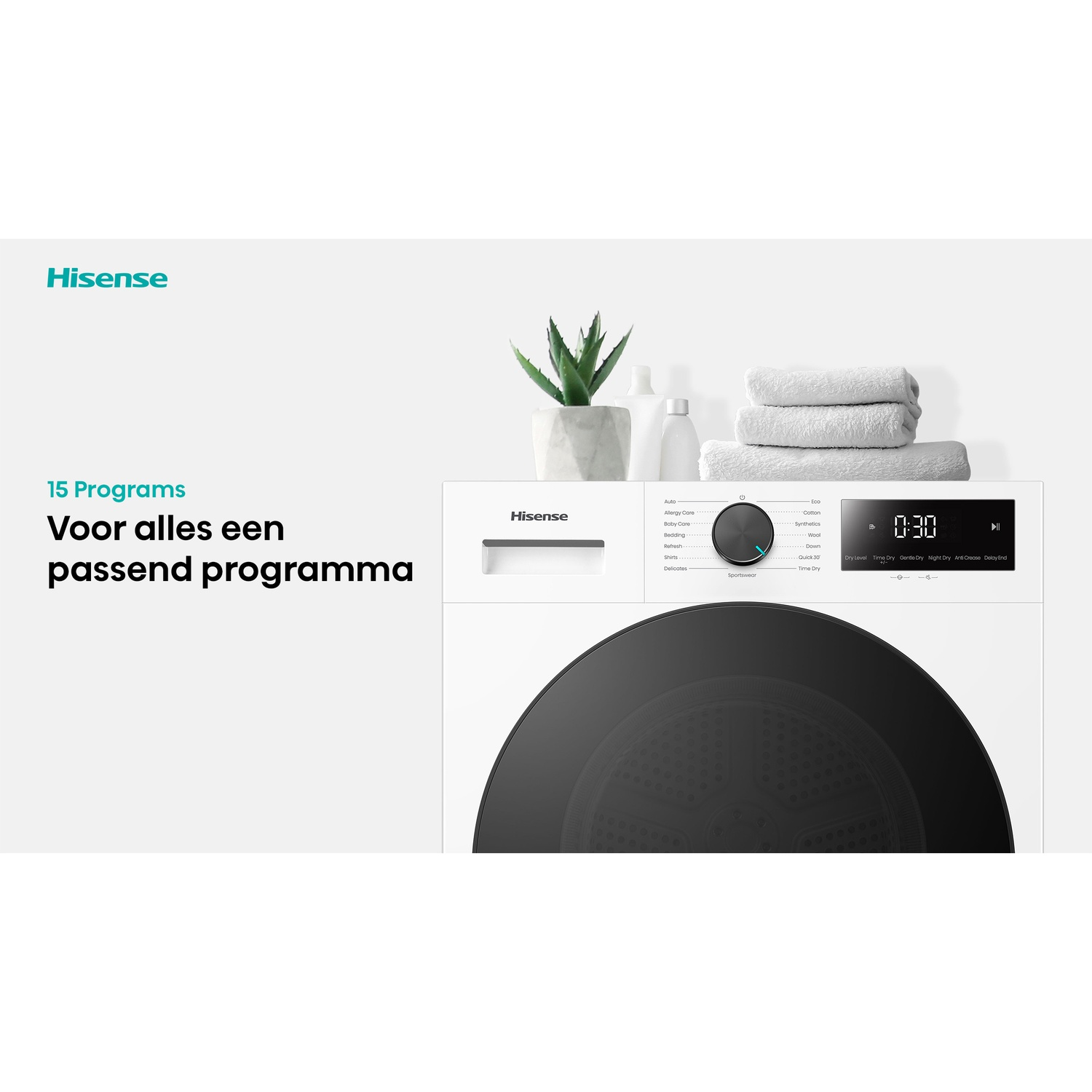 Hisense droger met digitaal display, draaiknop, opgevouwen handdoeken en een plantje bovenop.