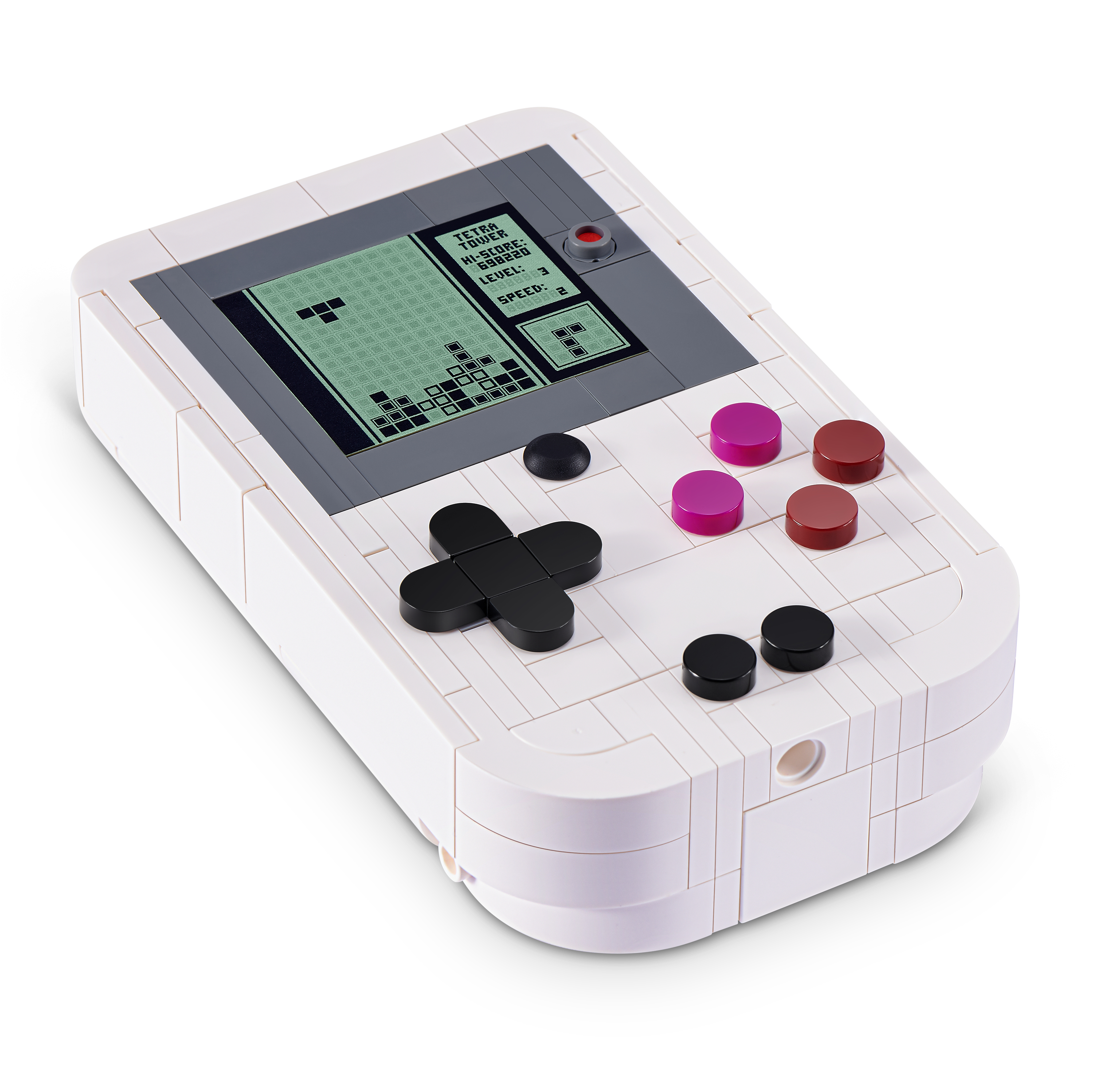 Una consola portátil blanca hecha de bloques muestra un juego de bloques en su pantalla sobre un fondo blanco.