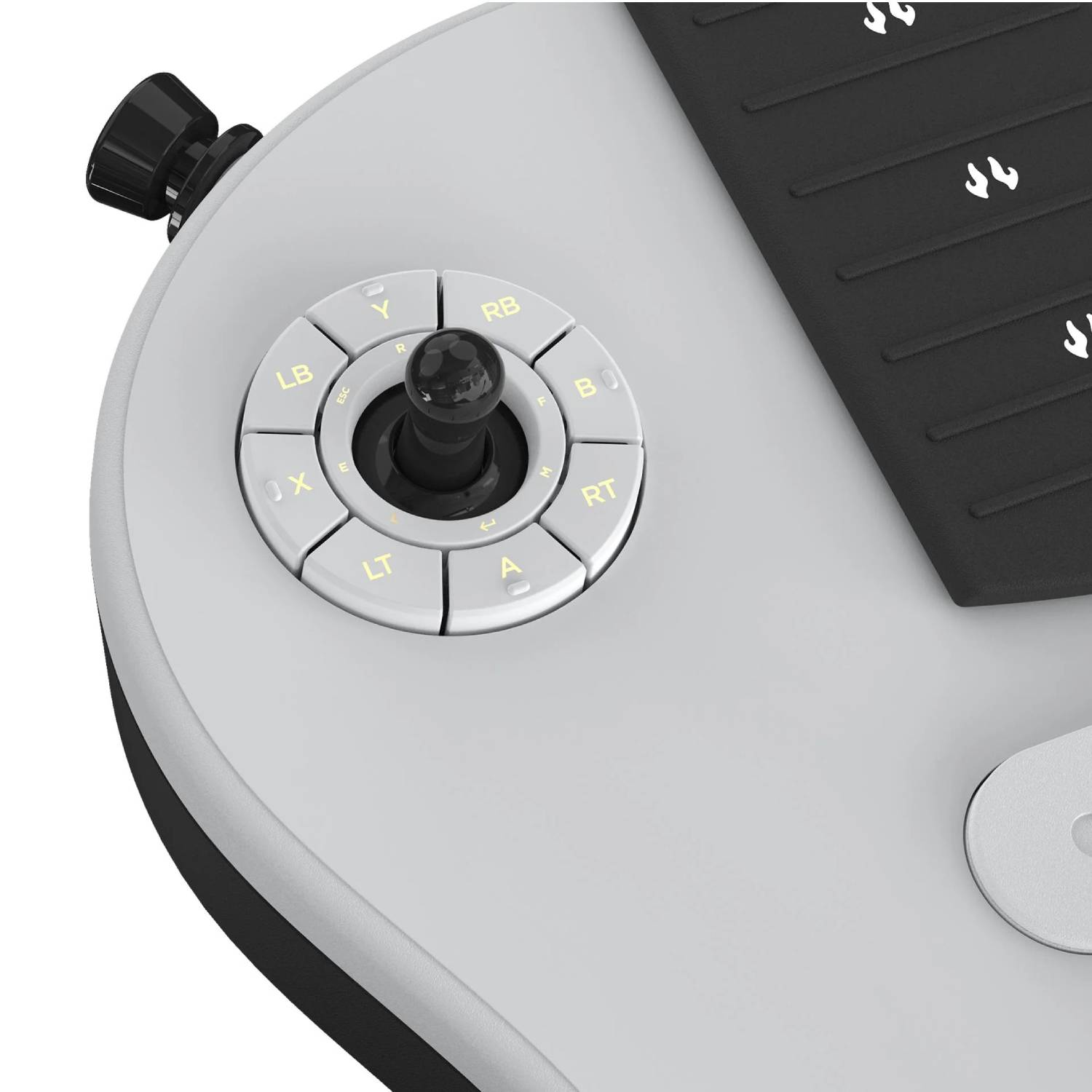Controlador gris con un joystick central y botones circundantes con iconos amarillos sobre una superficie lisa.