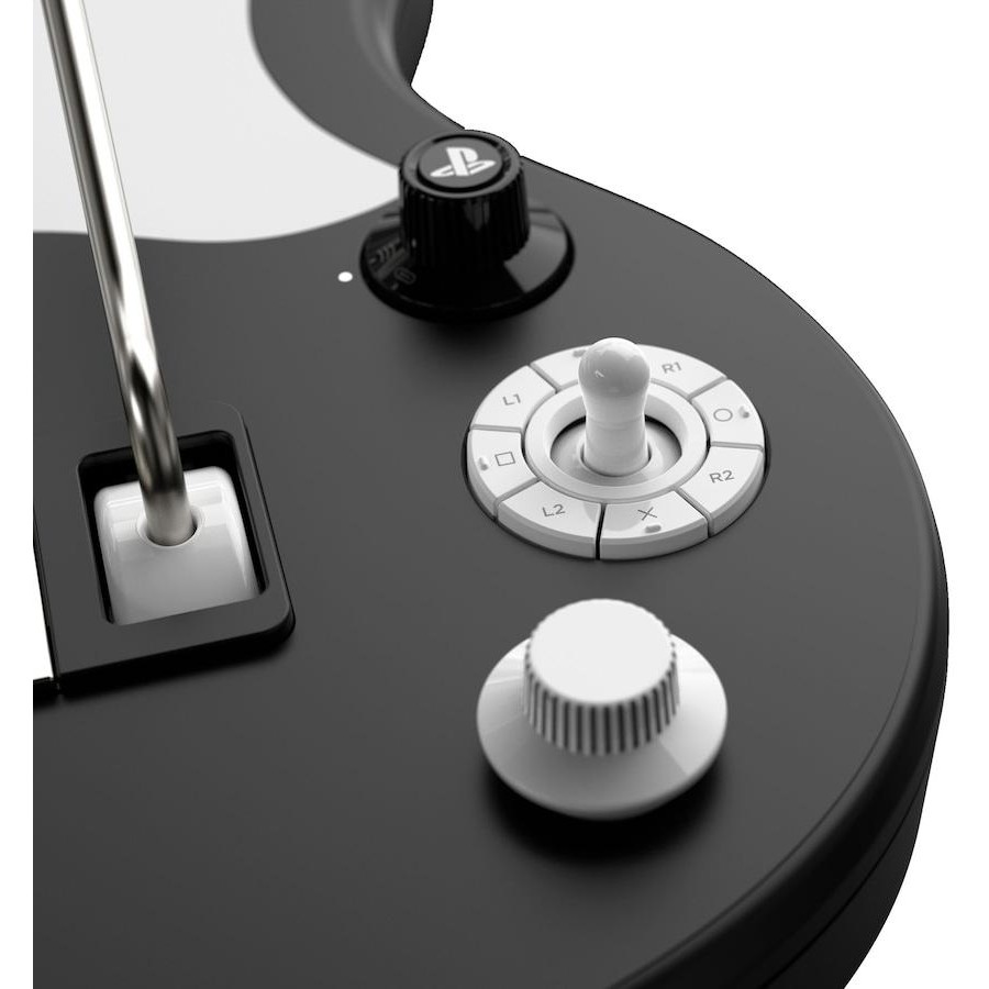 Primer plano de un controlador de guitarra negro con botones blancos, perillas y una barra de trémolo plateada.